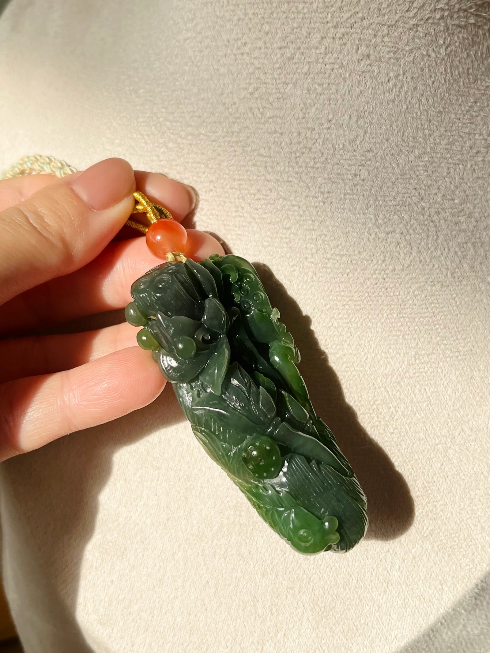 “Lotus Blessing ”- Hand Carved Green Hetian Jade Fish and Lotus Pendant, 手雕碧玉荷花鱼手把件 - detail close-up by L'Orient Haus