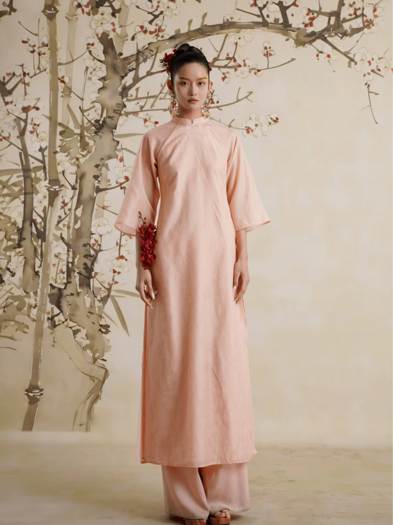 "Uyen My Ao Dai Set in salmon pink silk, traditional Vietnamese dress by Lalin, showcasing cultural heritage."