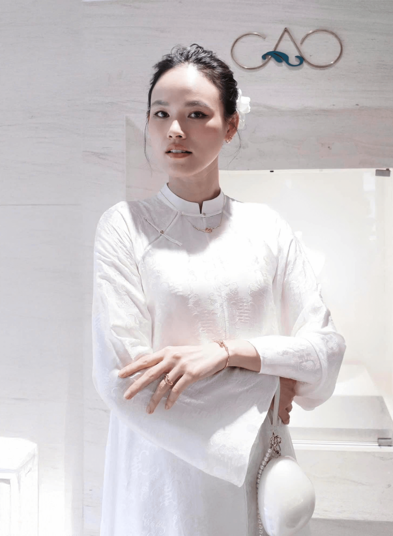 "Hy Loan Ao Dai Set in white silk by Lalin, traditional Vietnamese dress with modern artisan design."