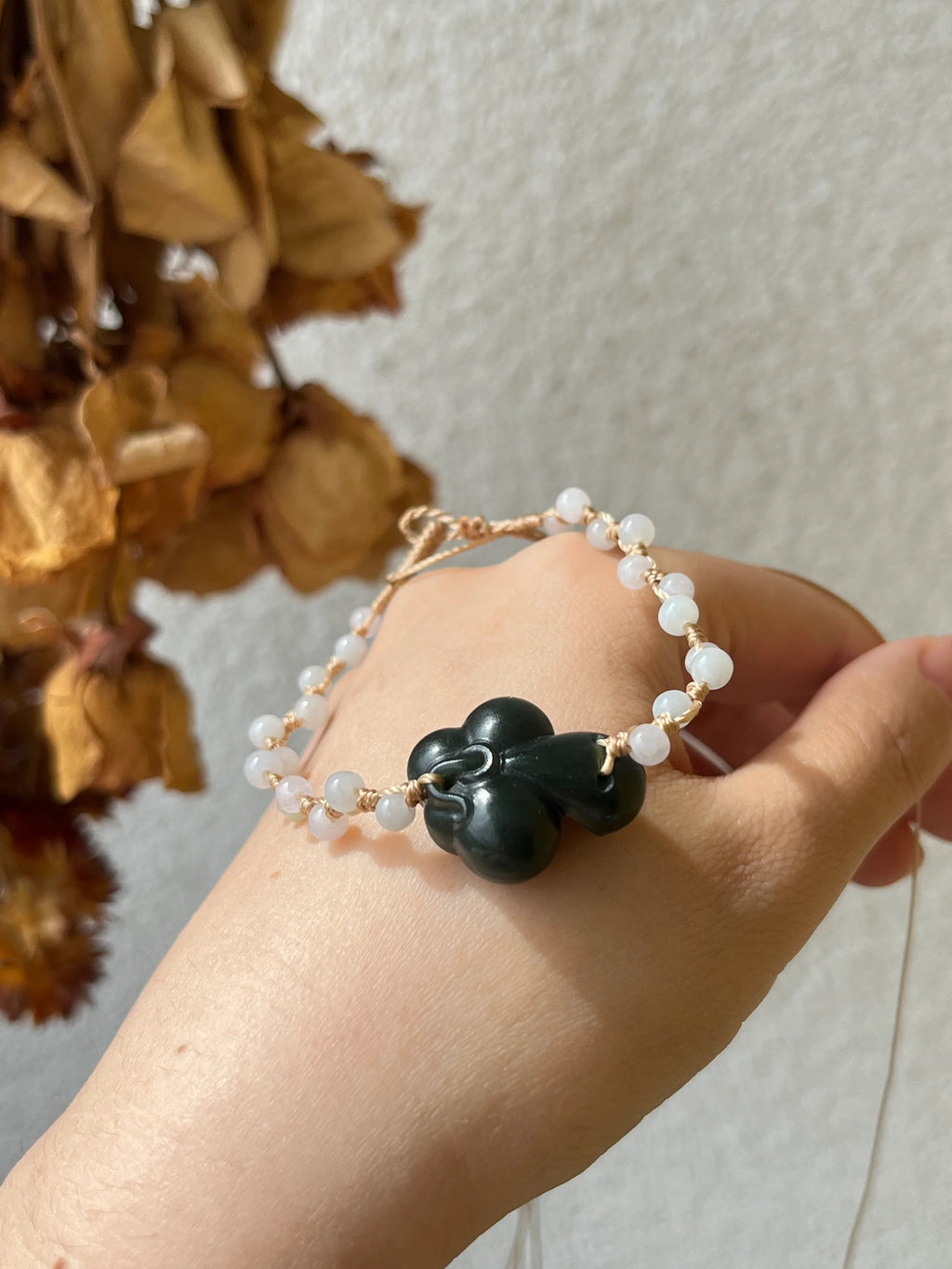 Lotus Noir - Handmade Bracelet with a Dark Cyan Hetian Jade Lotus | 手编和田青玉一细小荷花手牌 - worn presentation by L'Orient Haus