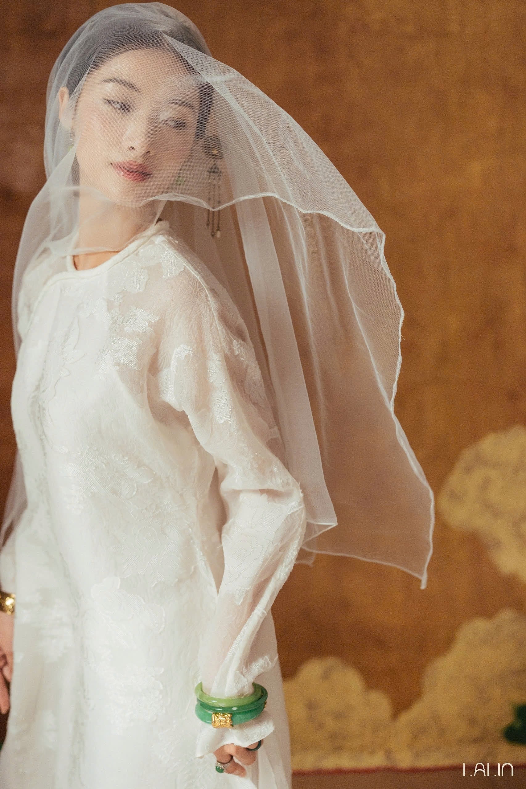 Tuyet Giao Ao-dai Set – Premium Double-layer Hand-Embroidered WormSilk in White [Wedding Collection] by Lalin - side view highlighting elegant silhouette and fabric drape, premium Vietnamese silk clothing