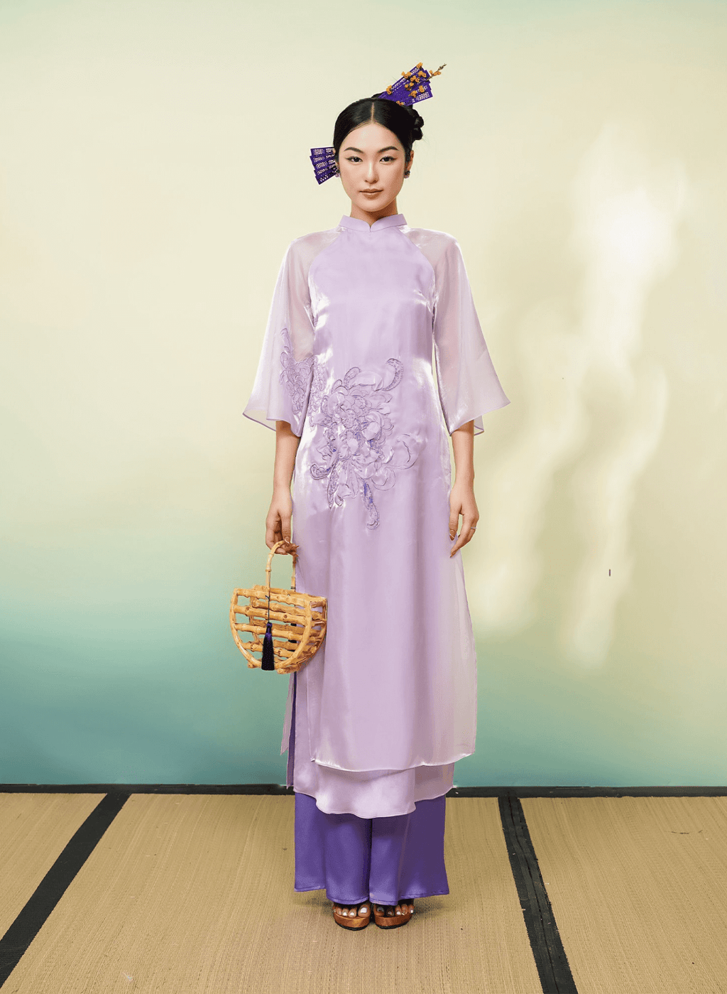 "Uyen Cuc Limited Edition Ao Dai in purple silk by Lalin, traditional Vietnamese dress with embellishments."