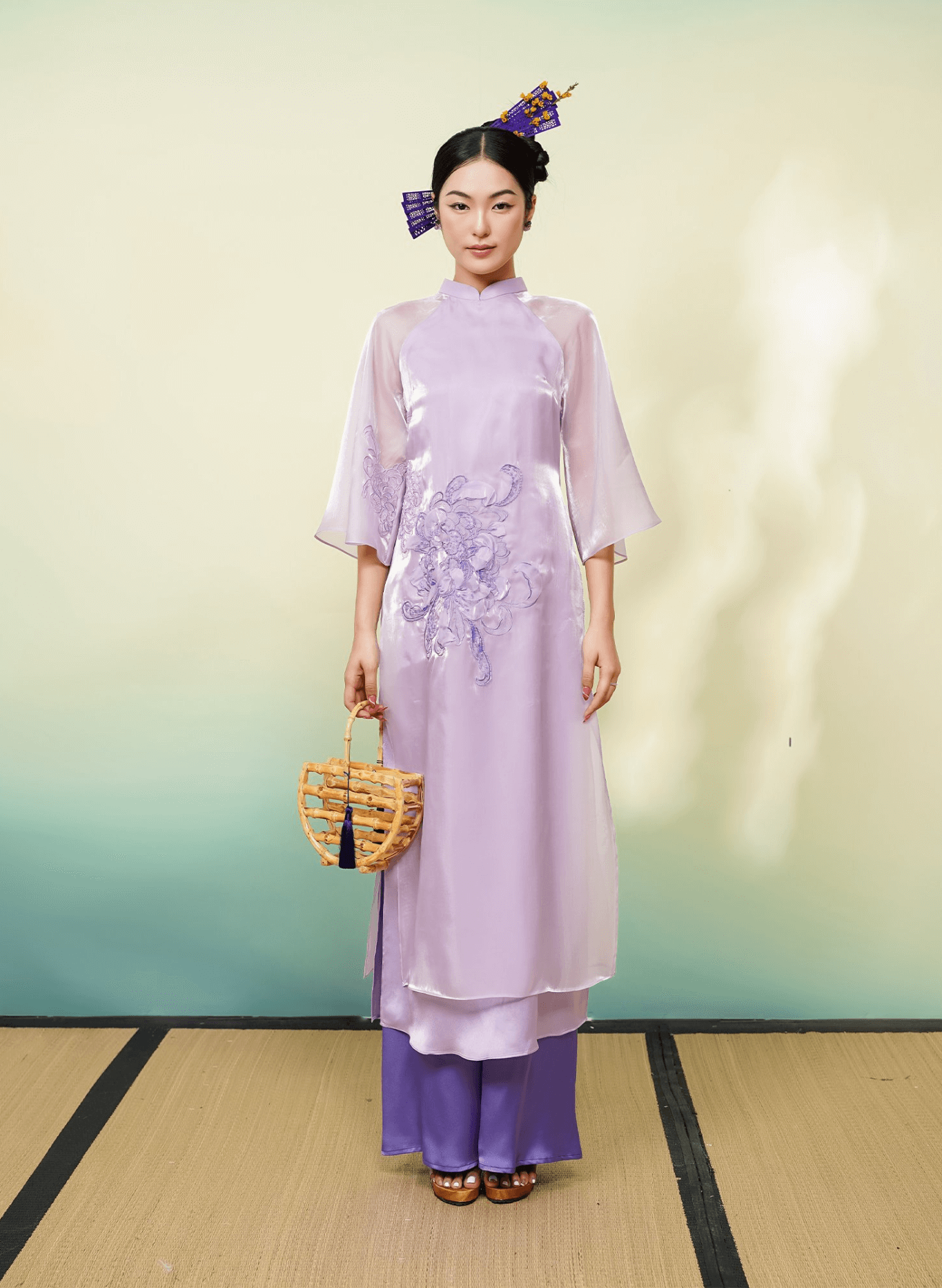 "Uyen Cuc Limited Edition Ao Dai in purple silk by Lalin, traditional Vietnamese dress with embellishments."