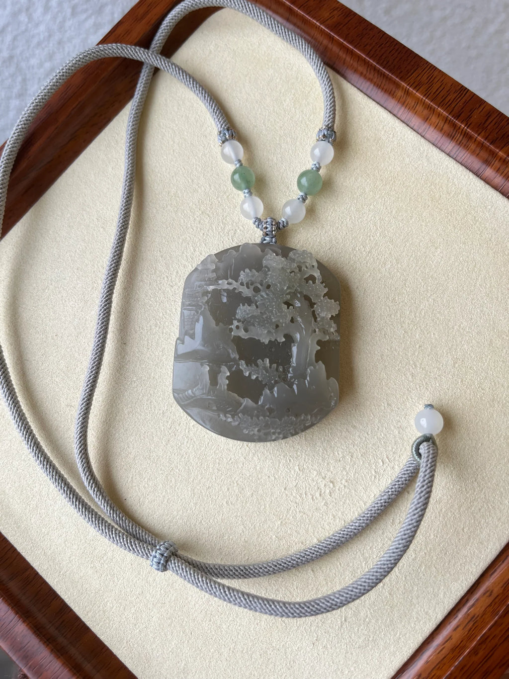 “Mist Valley Reverie” - Hand Carved Grayish Purple Hetian Jade Landscape | 和田烟紫山水 - flat lay display in gray by L'Orient Haus