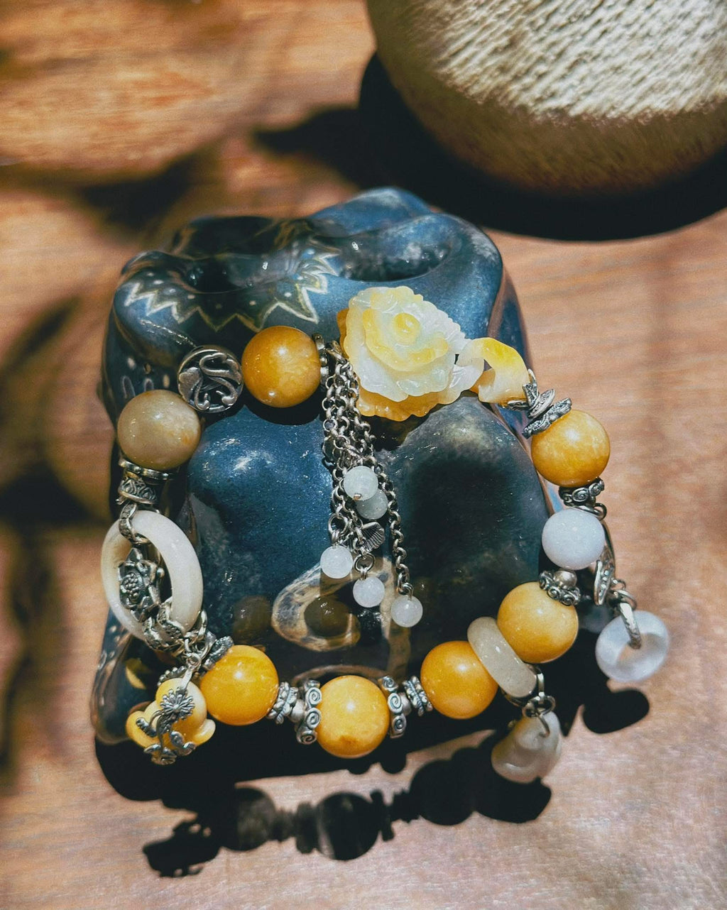 “Hoàng Phỉ Liên Hoa” – Designer's Jade Bracelet in Golden Amber - flat lay display by HI de Maison