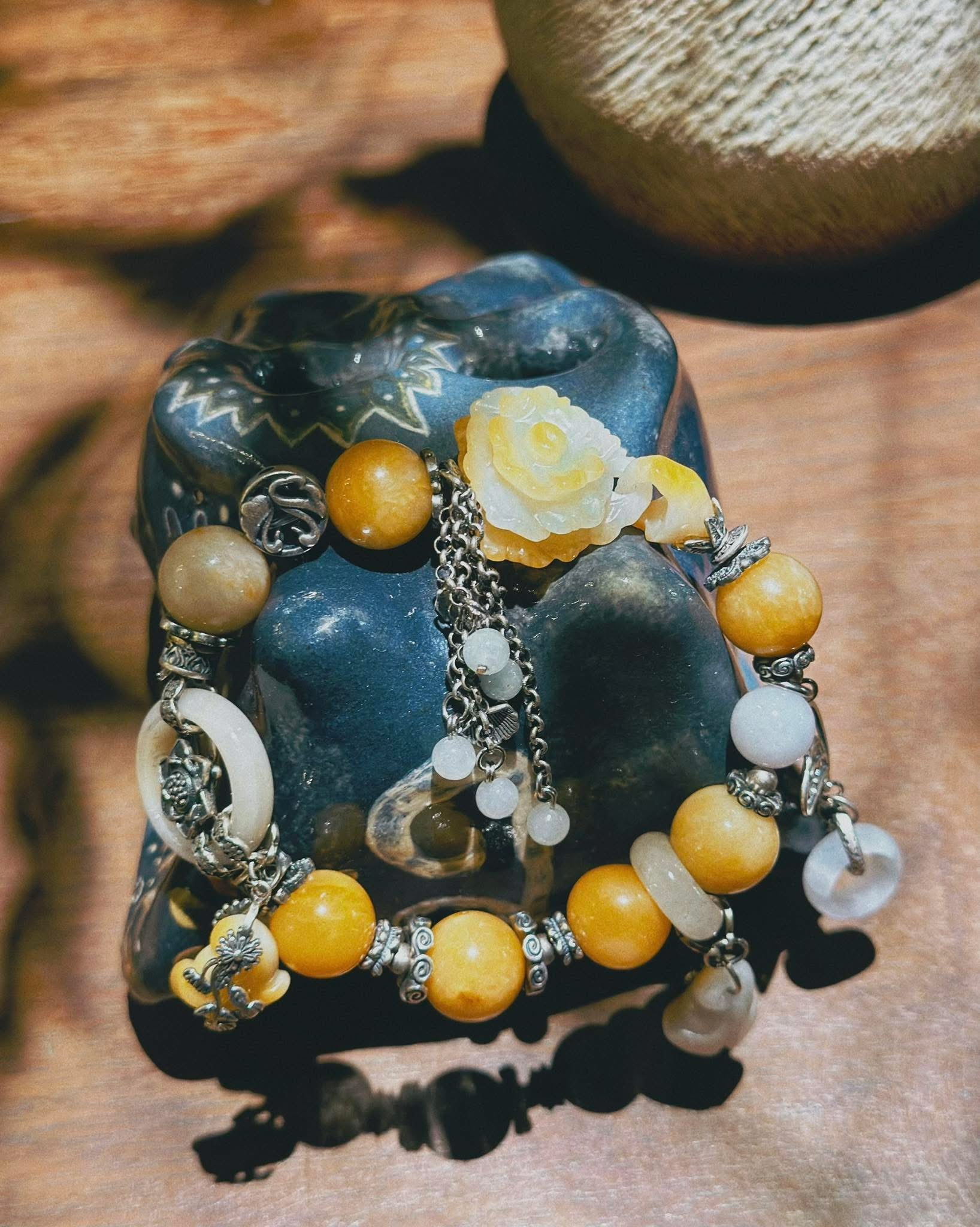 “Hoàng Phỉ Liên Hoa” – Designer's Jade Bracelet in Golden Amber - flat lay display by HI de Maison