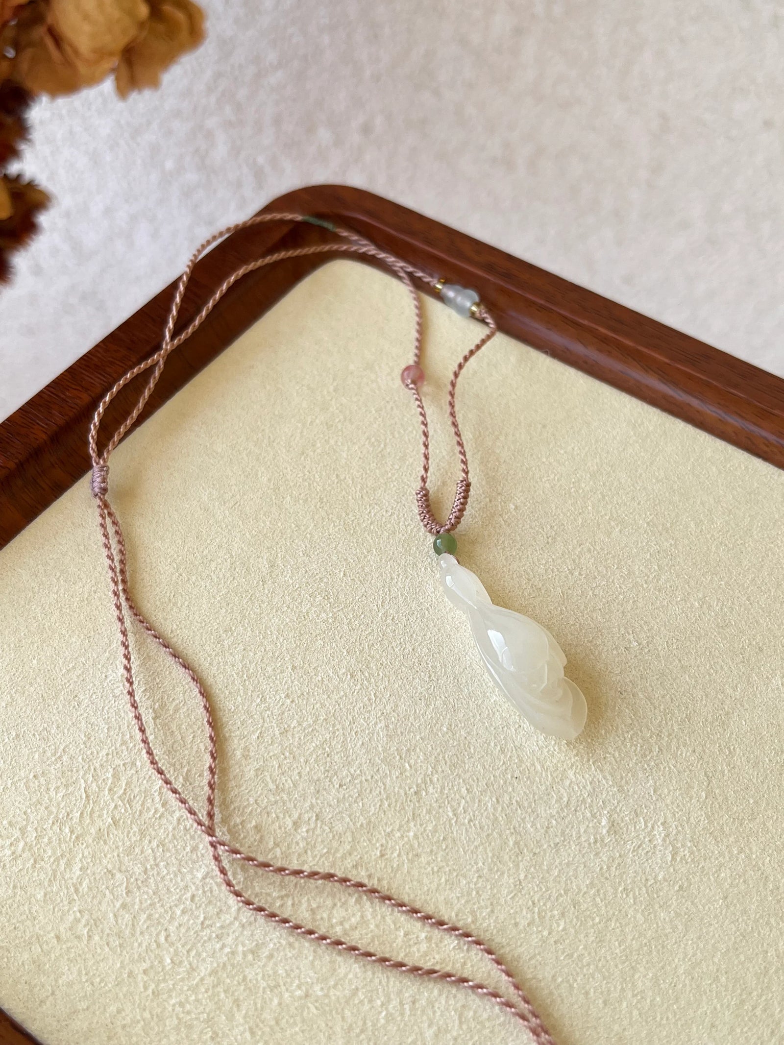 Blush Magnolia – Icy Pink Hetian Jade Pendant - flat lay display in cotton in #ffffff by L'Orient Haus