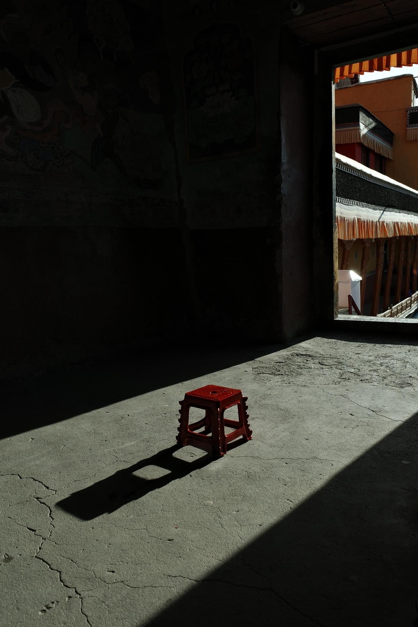 "Bat Trang Ceramics Dragon Street red ceramic stool, traditional Vietnamese design" - lifestyle shot