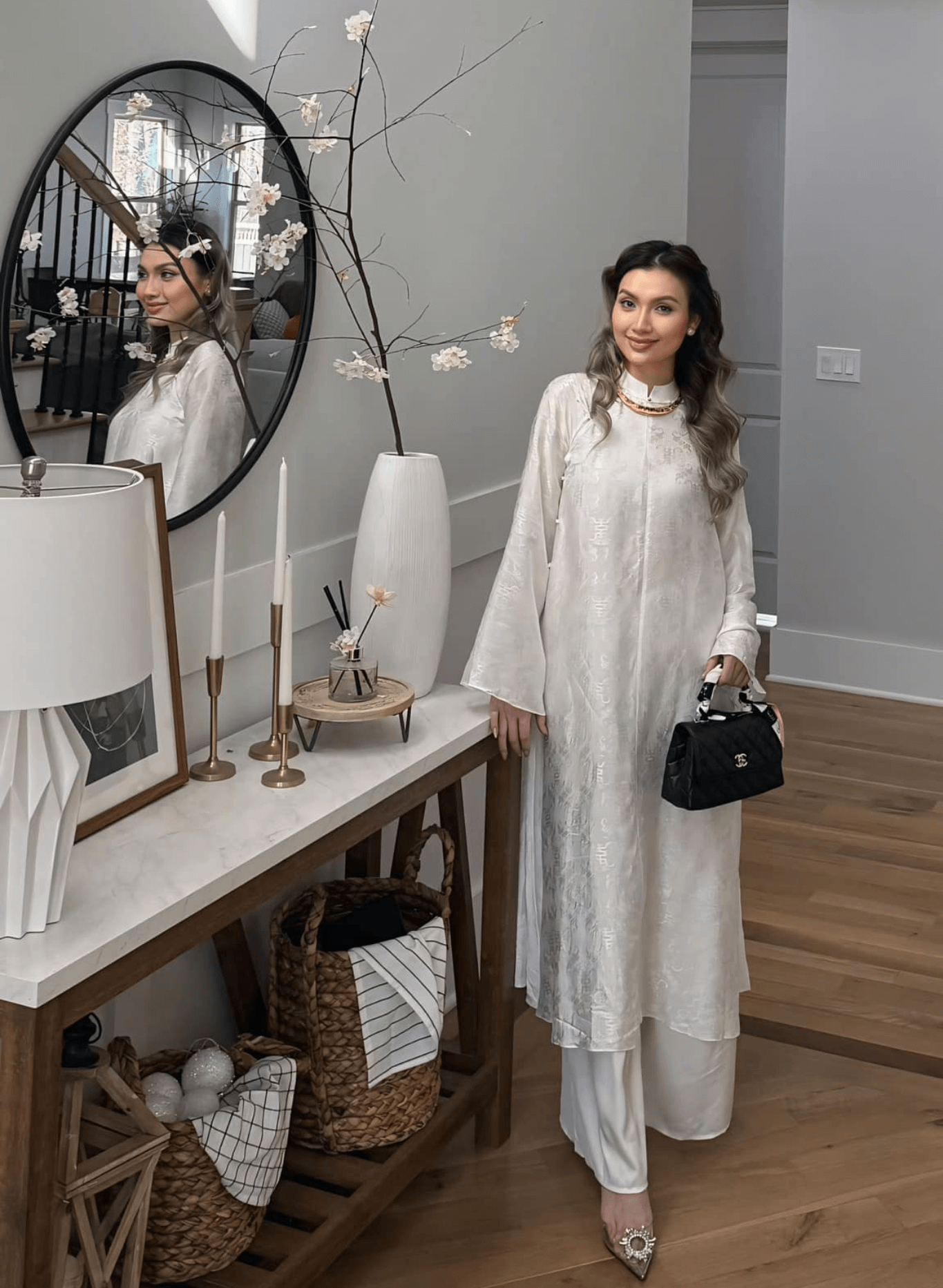 "Hy Loan Ao Dai Set in white silk by Lalin, traditional Vietnamese dress with modern artisan design."