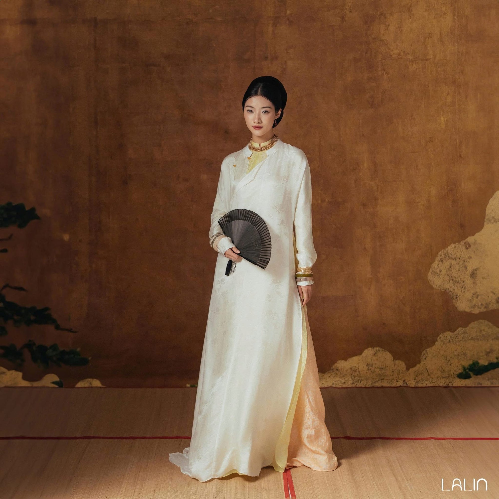 Nghi Giao Ao-dai Set – Luxury Double-layer Hand-Embroidered WormSilk in White [Wedding Collection] by Lalin - styled lifestyle shot demonstrating Vietnamese luxury fashion, premium Vietnamese silk clothing