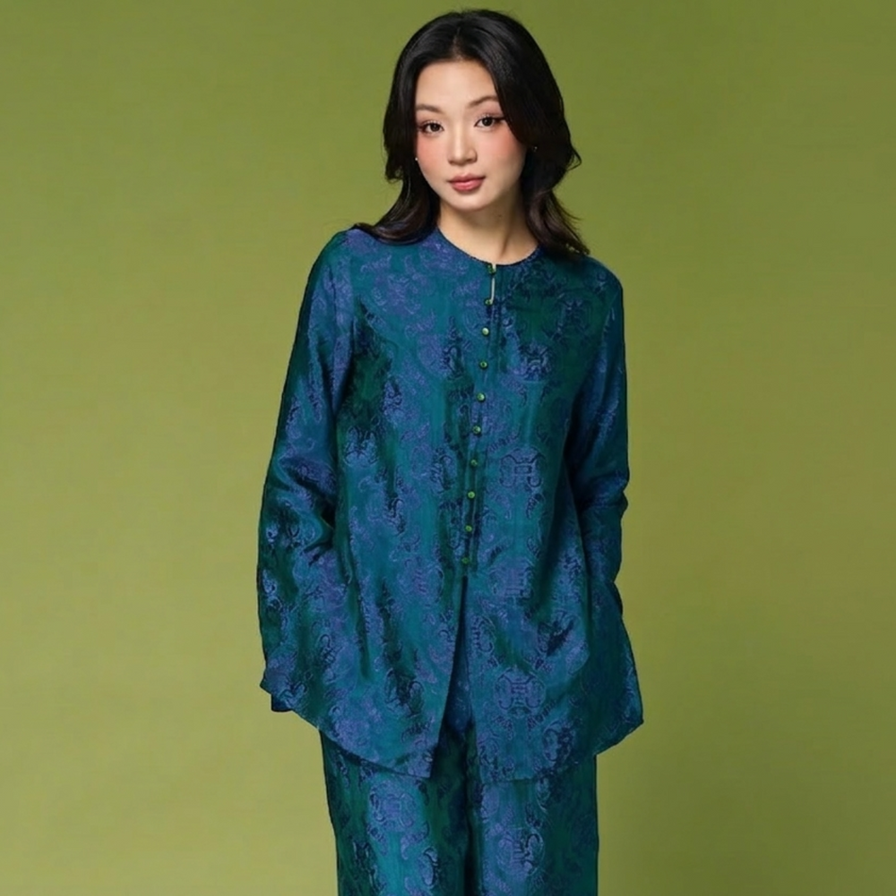front view shot of Ao ba ba in teal from Hy Phuong