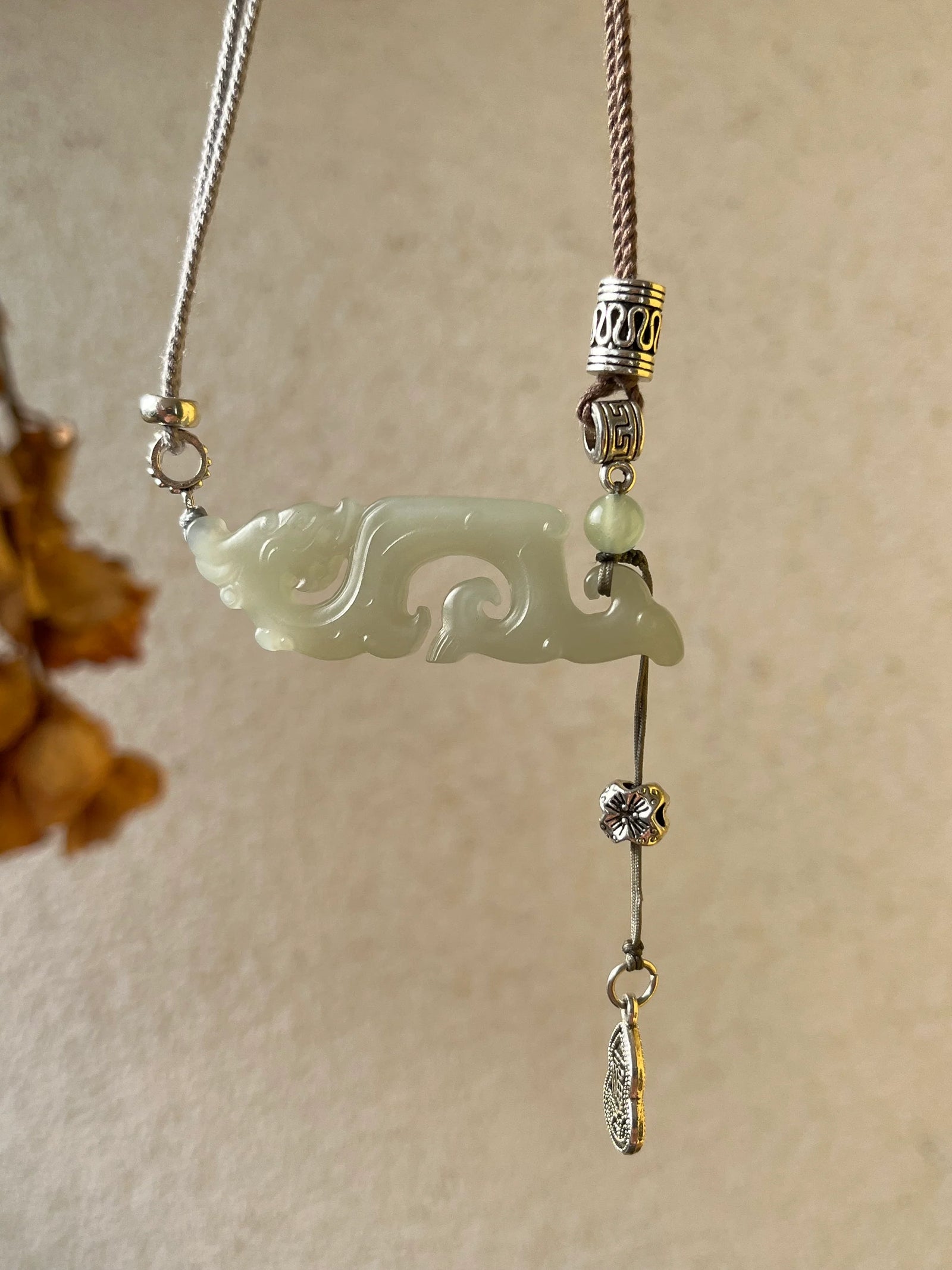 Traditional Motif - Celestial Dragon – Hand-Carved Nephrite Jade Necklace - front view in light-green by L'Orient Haus