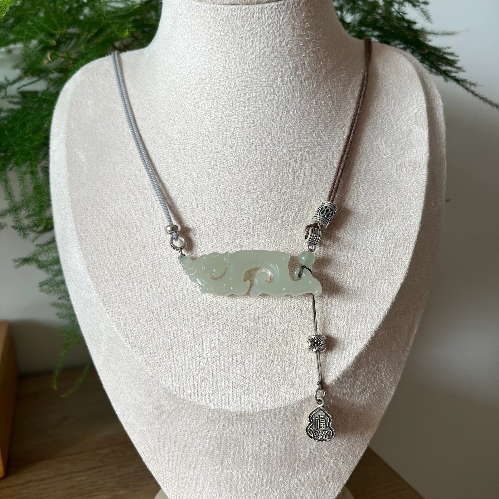 Traditional Motif - Celestial Dragon – Hand-Carved Nephrite Jade Necklace - front view in light green by L'Orient Haus