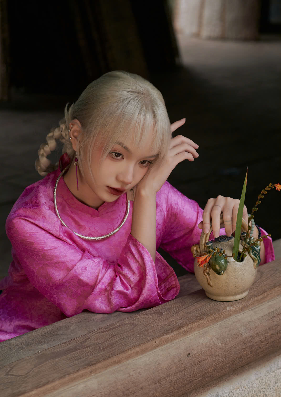 "Cuc Hoa Ao Dai set in pink wormsilk, traditional Vietnamese dress by Moc, artisan jacquard pattern."