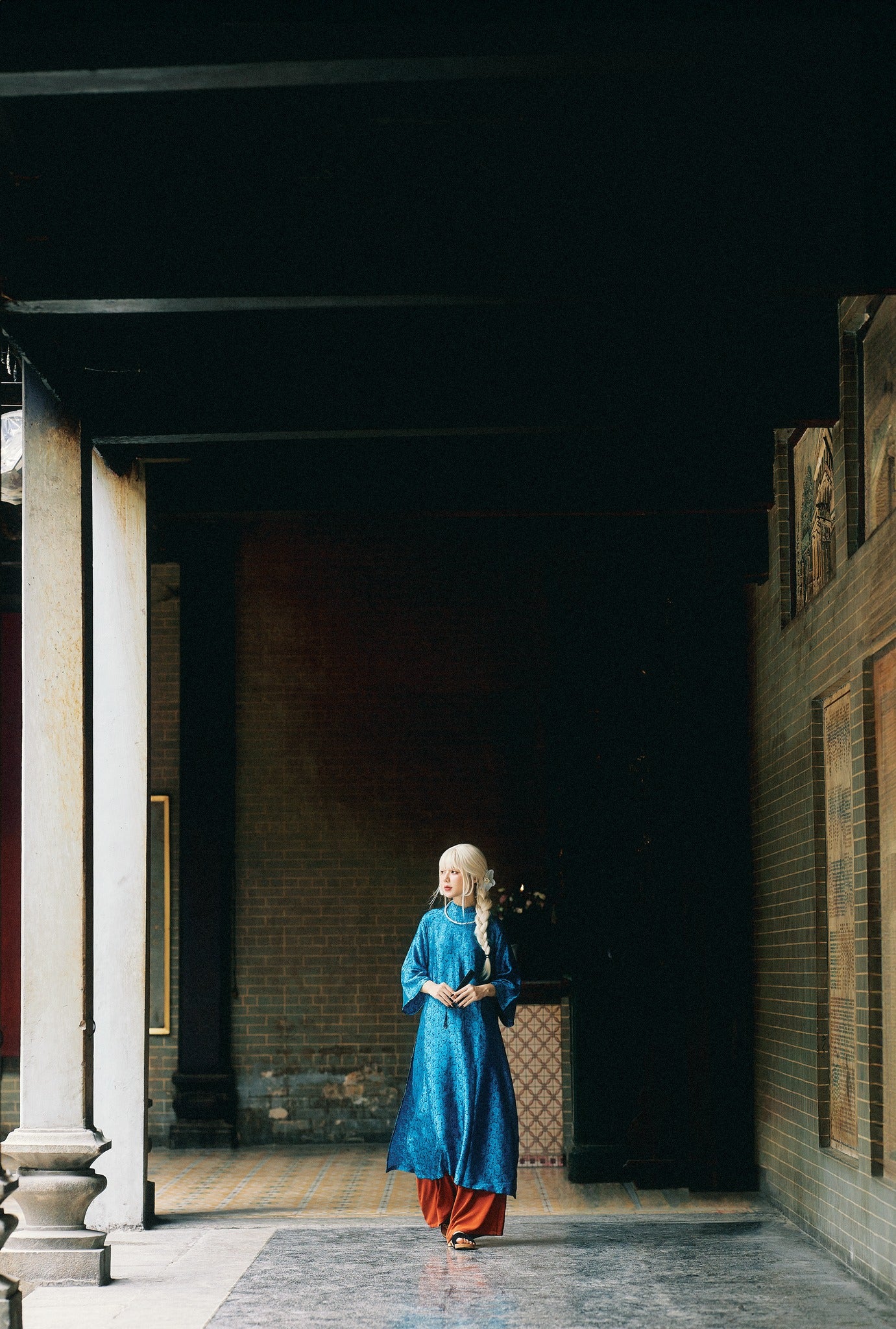 "Cuc Hoa Ao Dai set in sapphire blue silk, traditional Vietnamese dress by Moc."