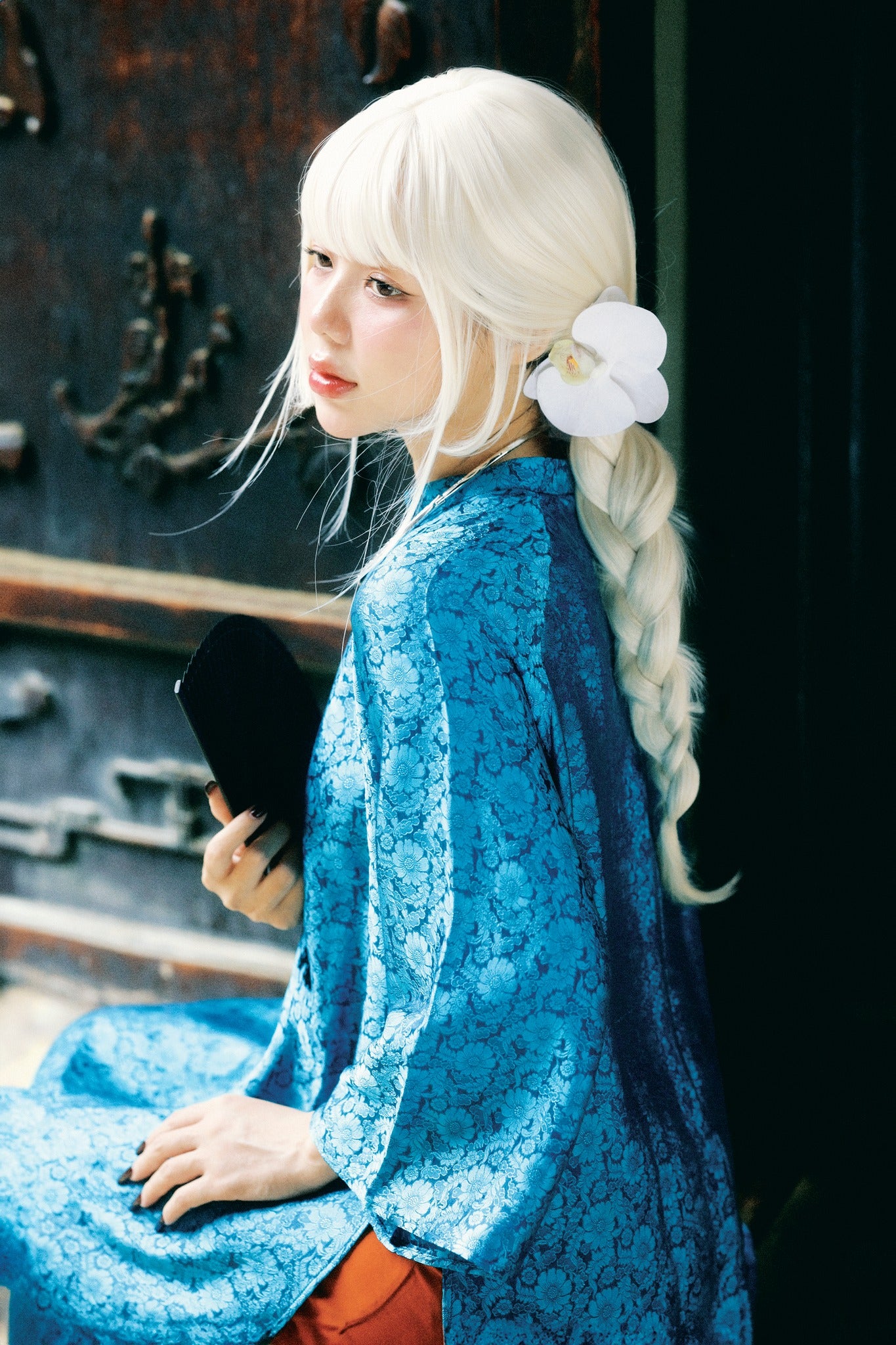 "Cuc Hoa Ao Dai set in sapphire blue silk, traditional Vietnamese dress by Moc, artisan jacquard pattern."