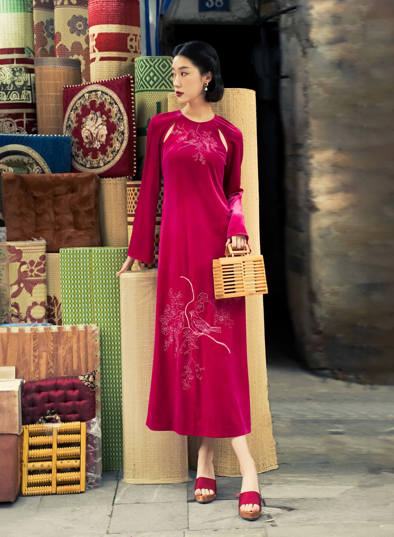 "Diem Quyen Ao Dai Halter Dress in red velvet with cut-out embroidery, Vietnamese artisan design by Lalin."