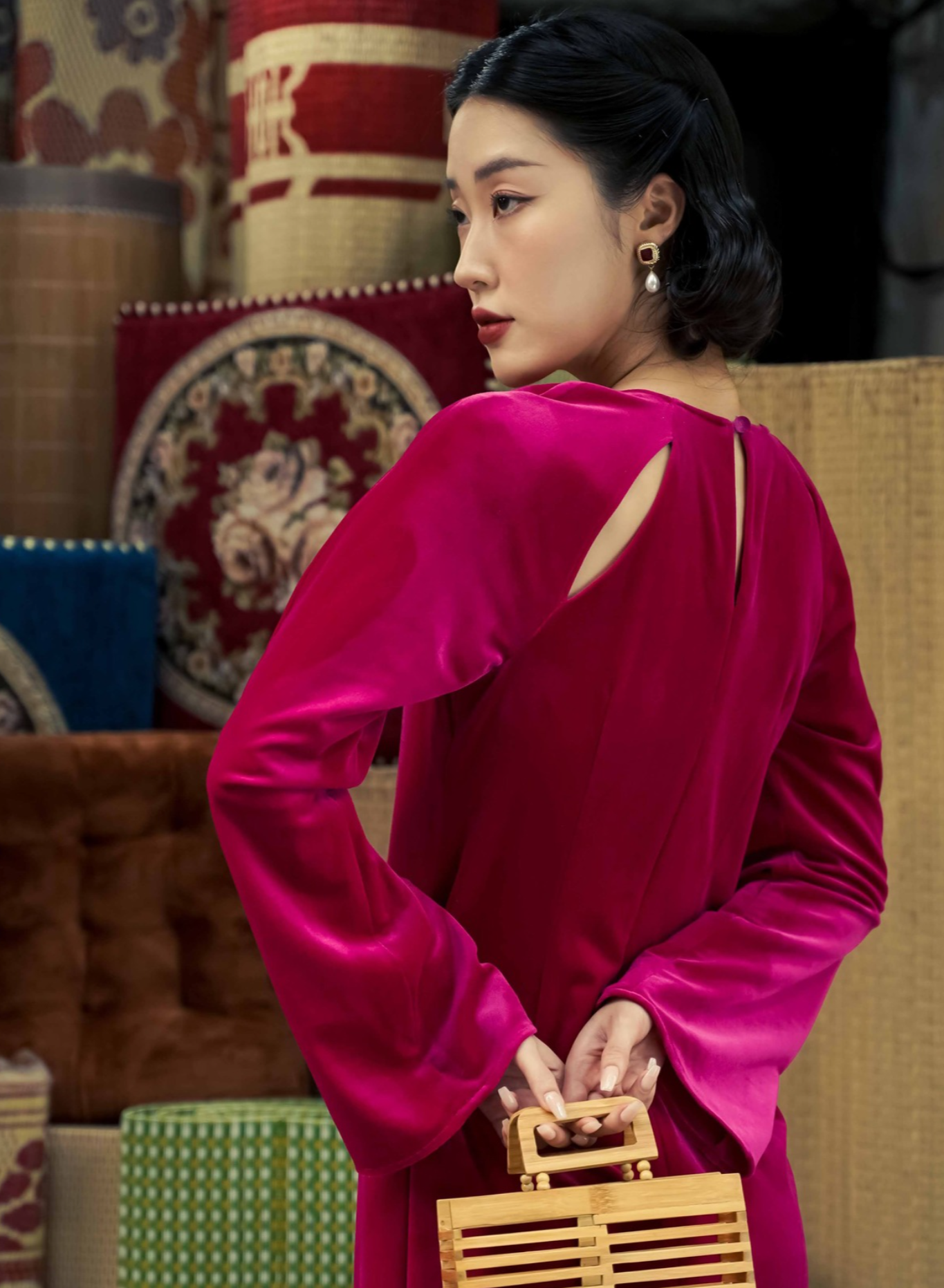 "Red 'Diem Quyen' Ao Dai Halter Dress by Lalin, artisan velvet with modern cut-out design, Vietnamese cultural elegance."