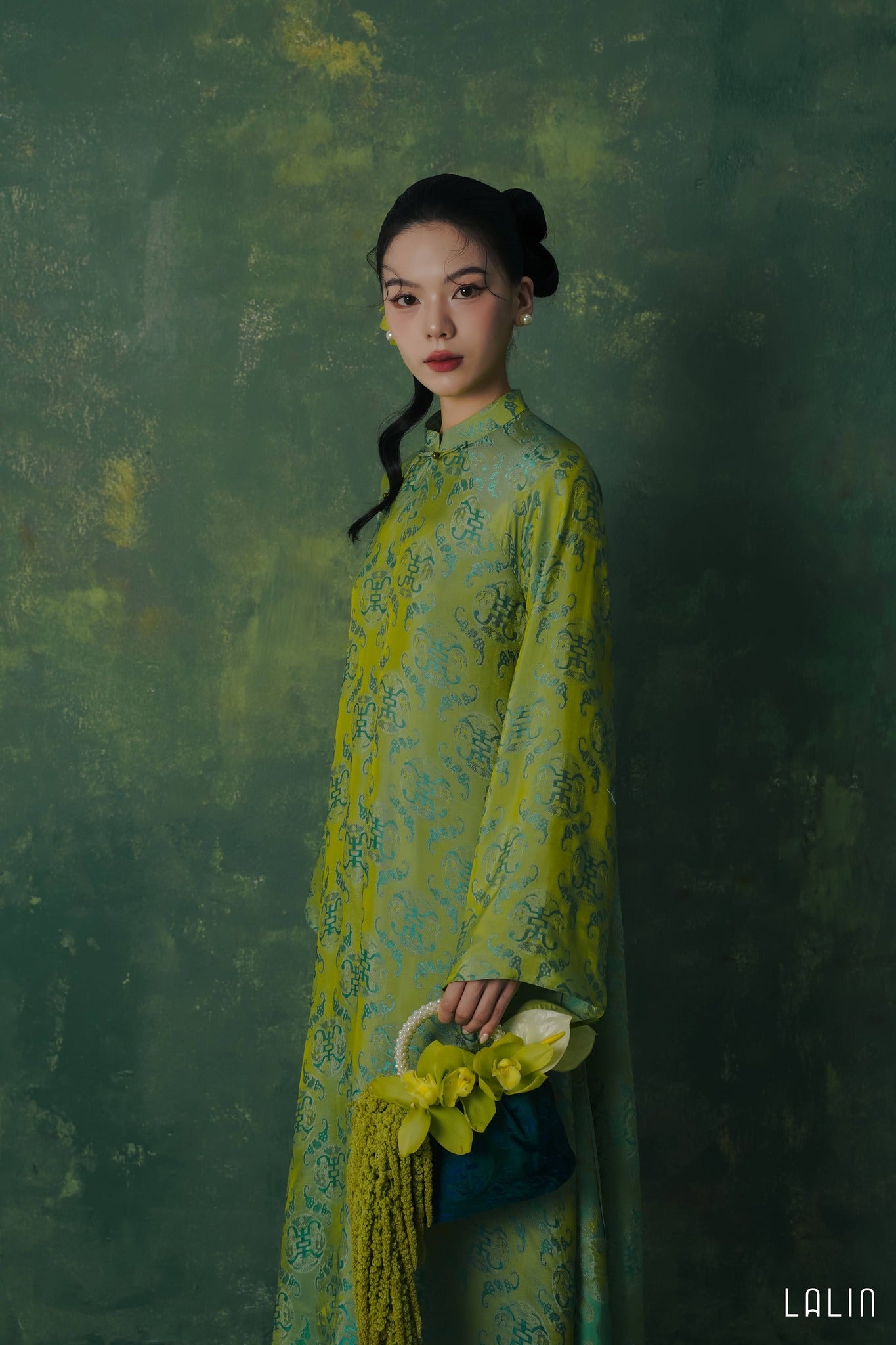 "Diep Thanh Ao Dai set by Lalin in jade green silk, traditional Vietnamese dress with modern patterns."