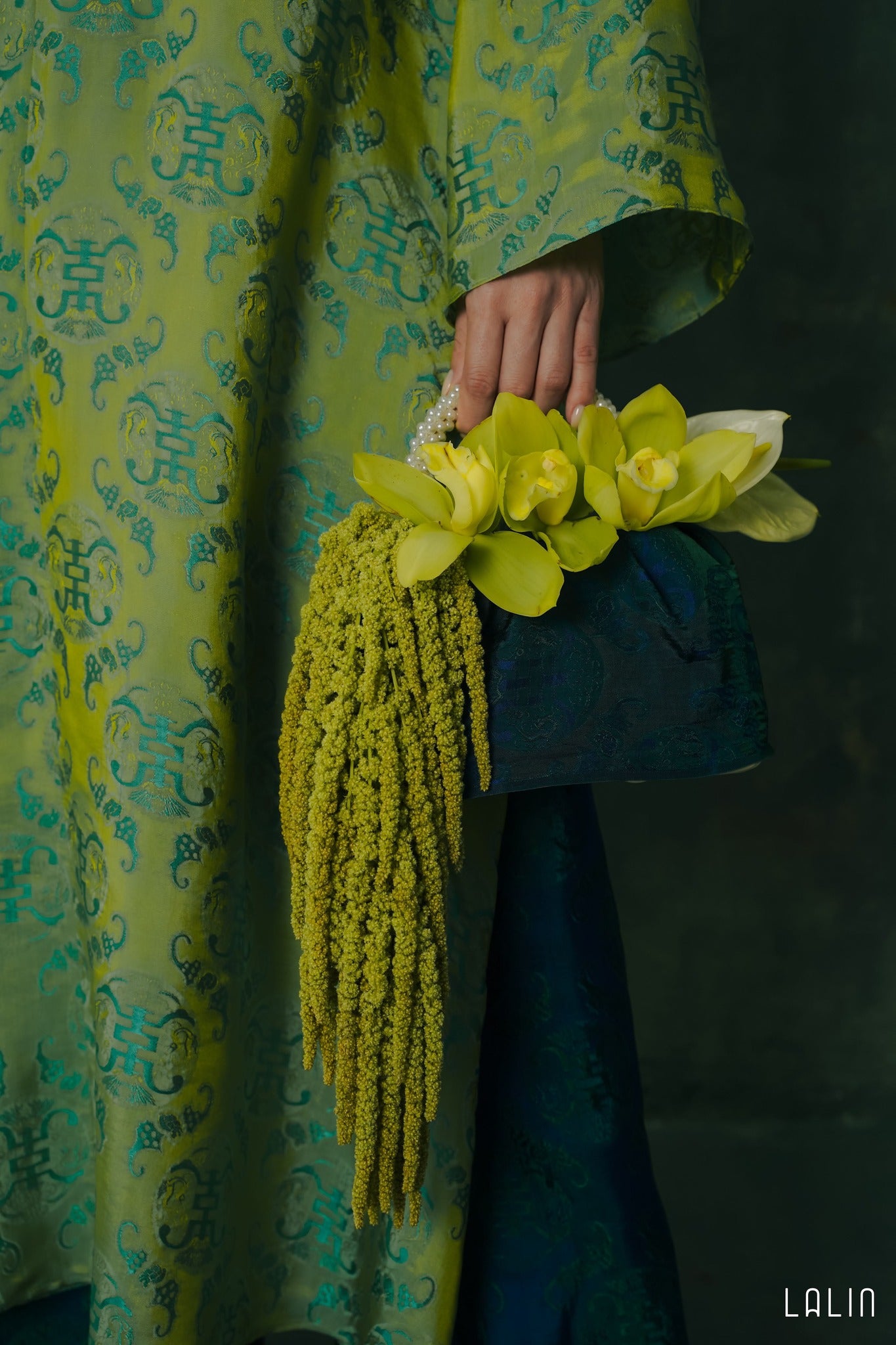 "Diep Thanh Ao Dai set in jade silk with traditional Vietnamese patterns, by Lalin"