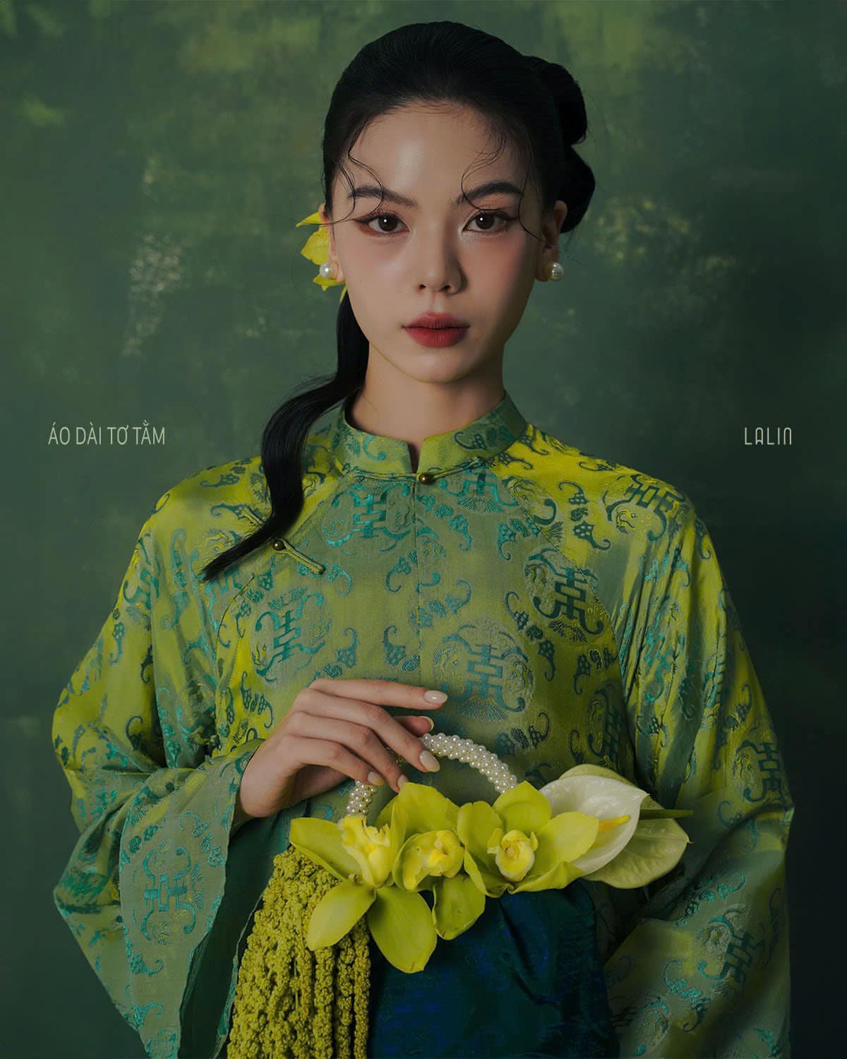 "Diep Thanh Ao Dai set by Lalin in green silk, traditional Vietnamese dress with modern patterns."