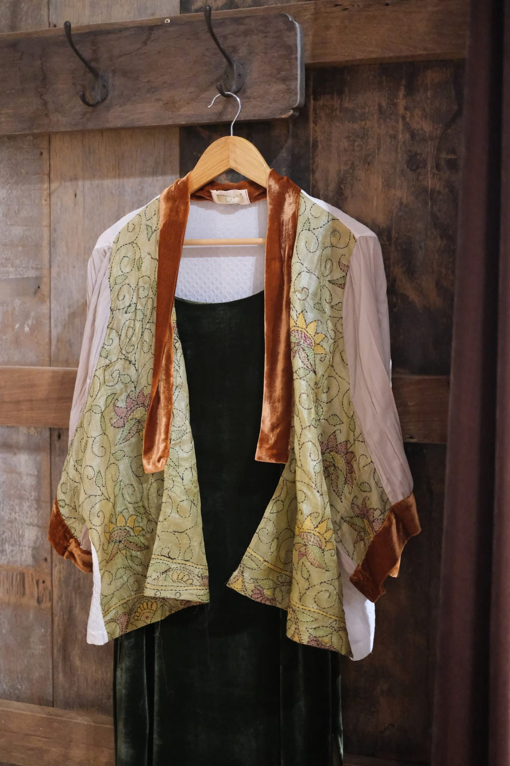 "Yuki embroidered chiffon short cardigan by Huulala, pink with orange suede liner, artisan floral pattern."