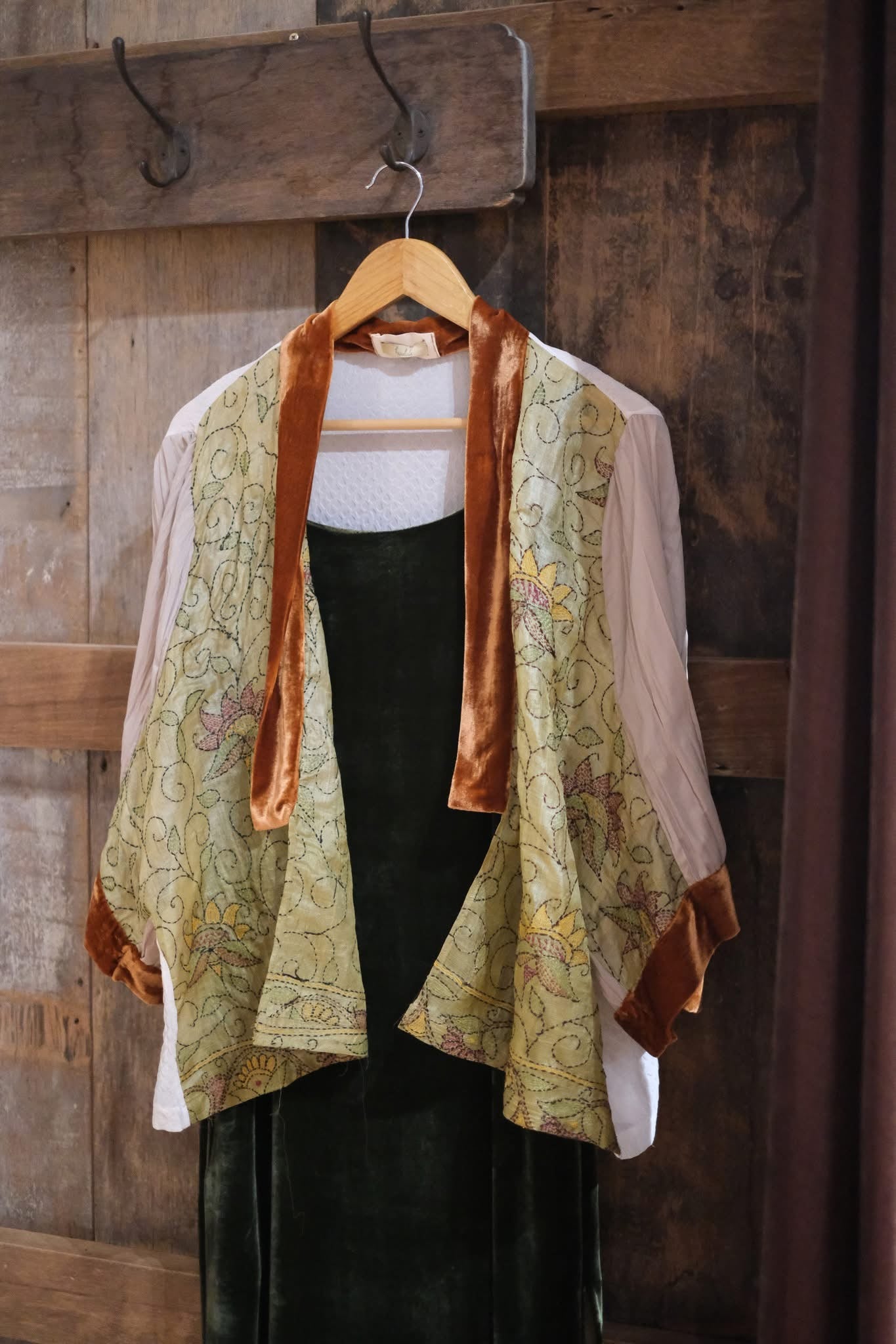 "Yuki embroidered chiffon short cardigan by Huulala, pink with orange suede liner, artisan floral pattern."
