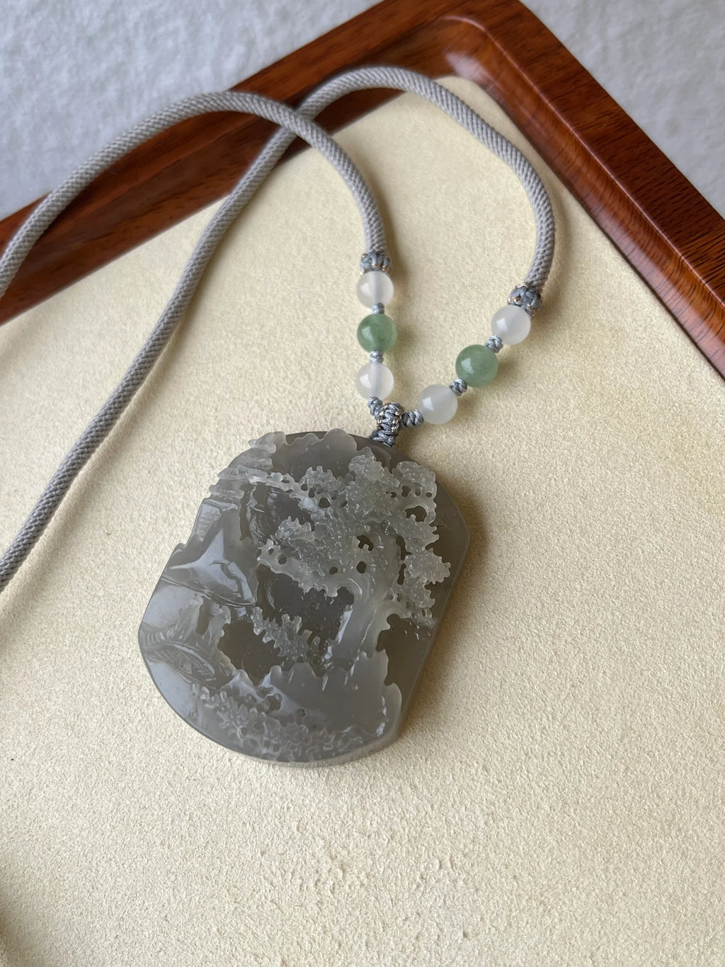 “Mist Valley Reverie” - Hand Carved Grayish Purple Hetian Jade Landscape | 和田烟紫山水 - flat lay display in gray by L'Orient Haus