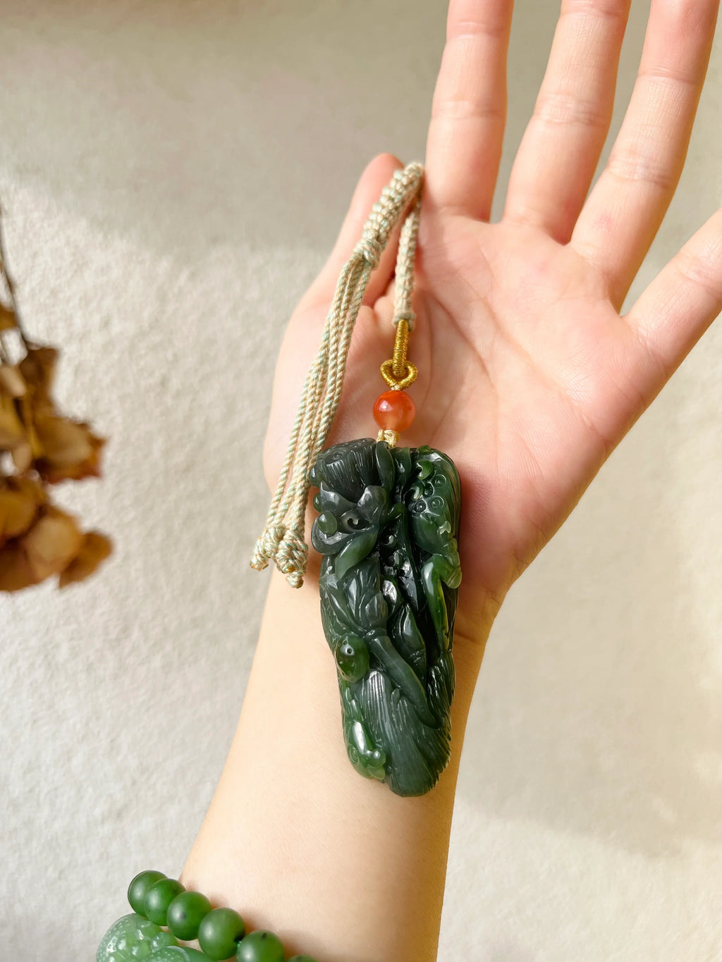 “Lotus Blessing ”- Hand Carved Green Hetian Jade Fish and Lotus Pendant, 手雕碧玉荷花鱼手把件 - detail close-up by L'Orient Haus
