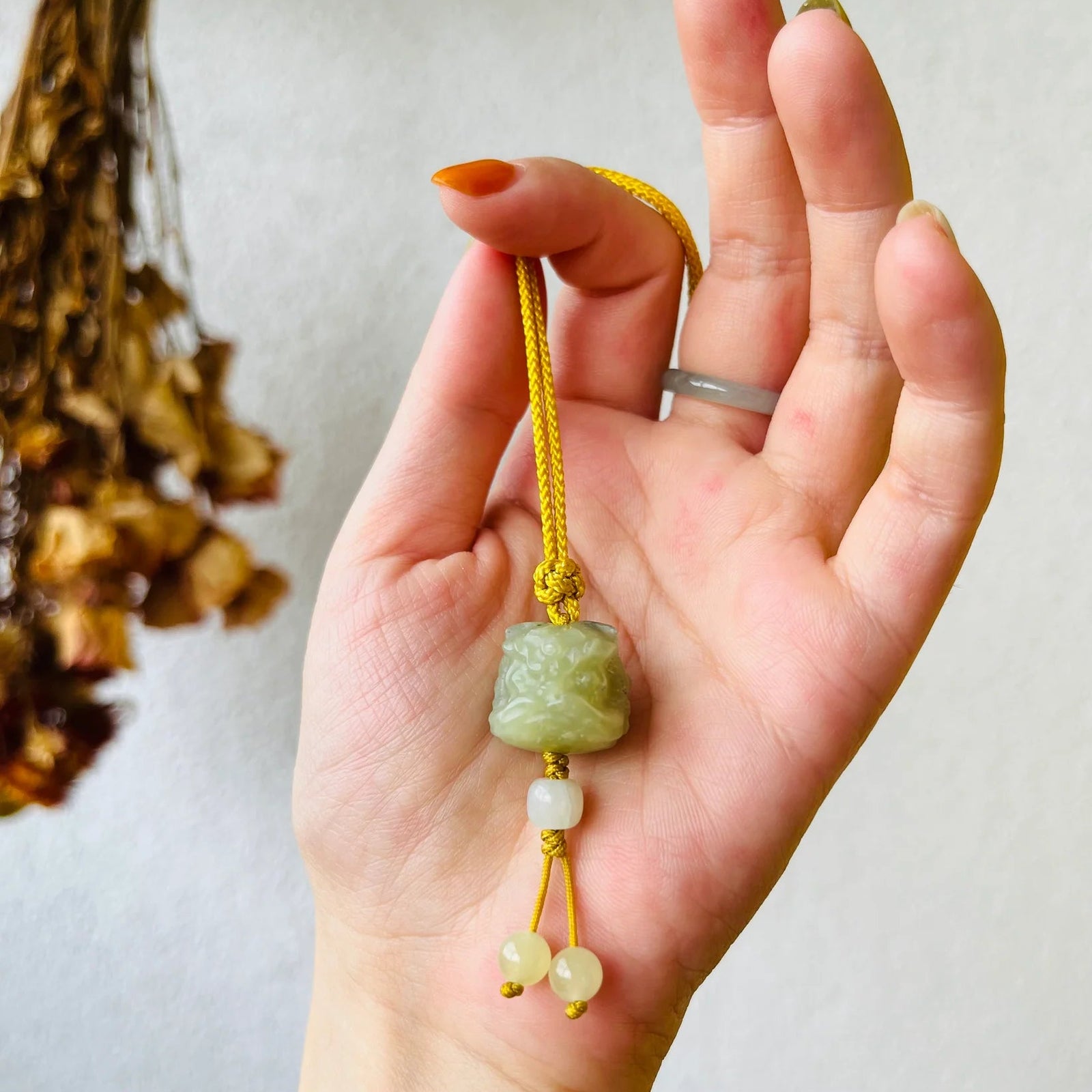 Guardian's Fortune – Hand-Carved Hetian Jade Lion Dance Charm - detail close-up by L'Orient Haus