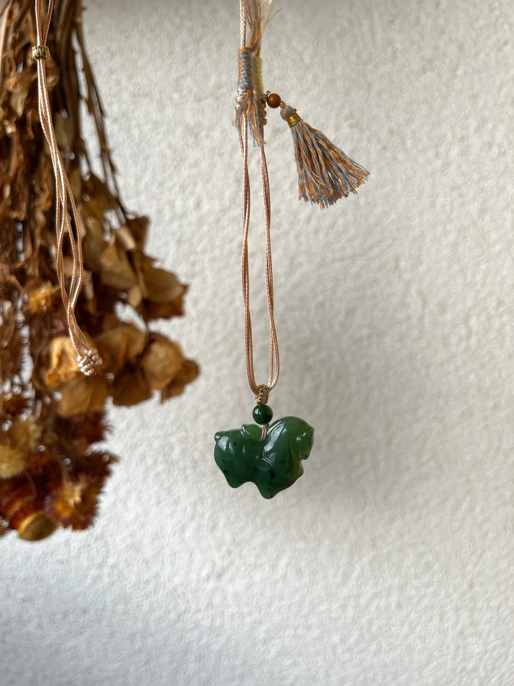 Gallant Spirit – Hand-Carved Hetian Jade Horse Charm - detail close-up in silk in green by L'Orient Haus