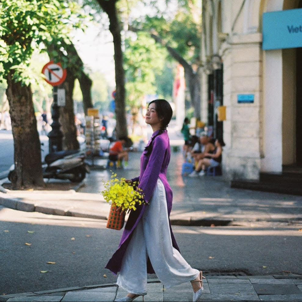 "Lien Hoa Ao Dai set in purple silkworm silk, traditional Vietnamese dress, artisan woven design."