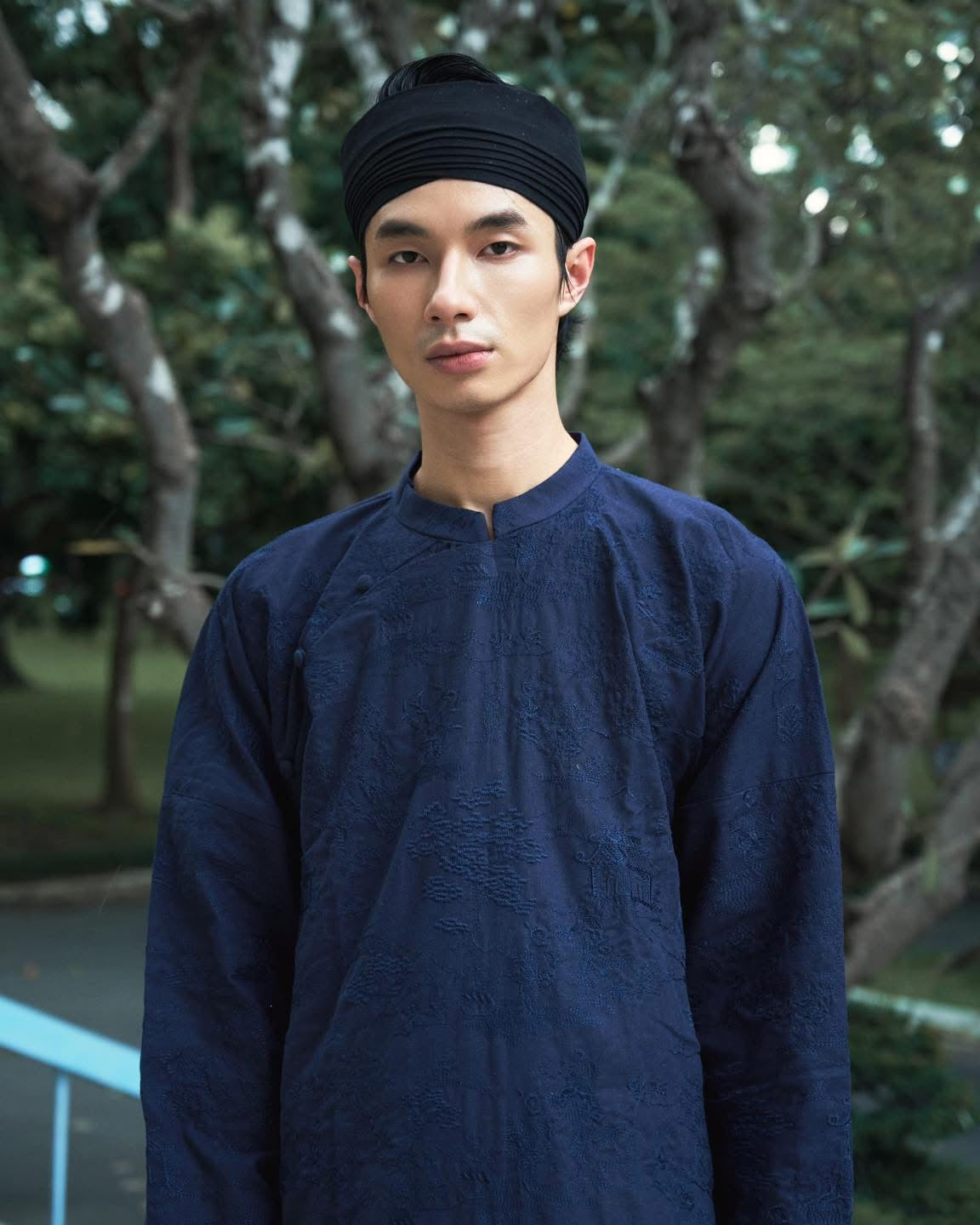 Vietnamese Embroidery - TAM PHƯƠNG – Men’s Hand-Embroidered Linen Áo Dài - front view in brocade in navy blue by Maison LONG