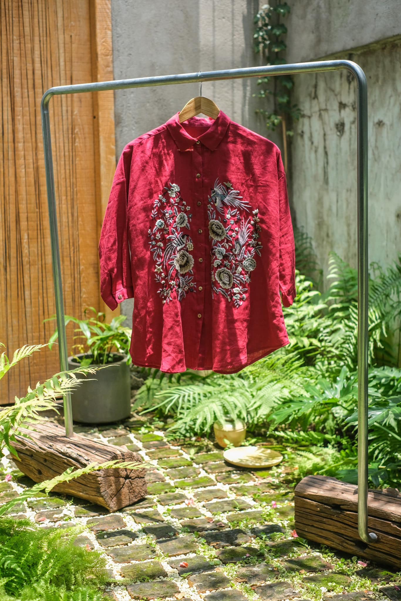 "Fire Phoenix" red embroidered linen shirt by Huulala, featuring Vietnamese floral patterns.