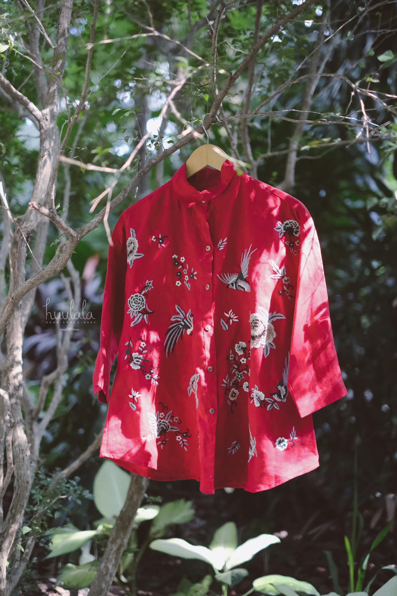 "Fire Phoenix" embroidered red linen shirt by Huulala, featuring Vietnamese floral patterns.