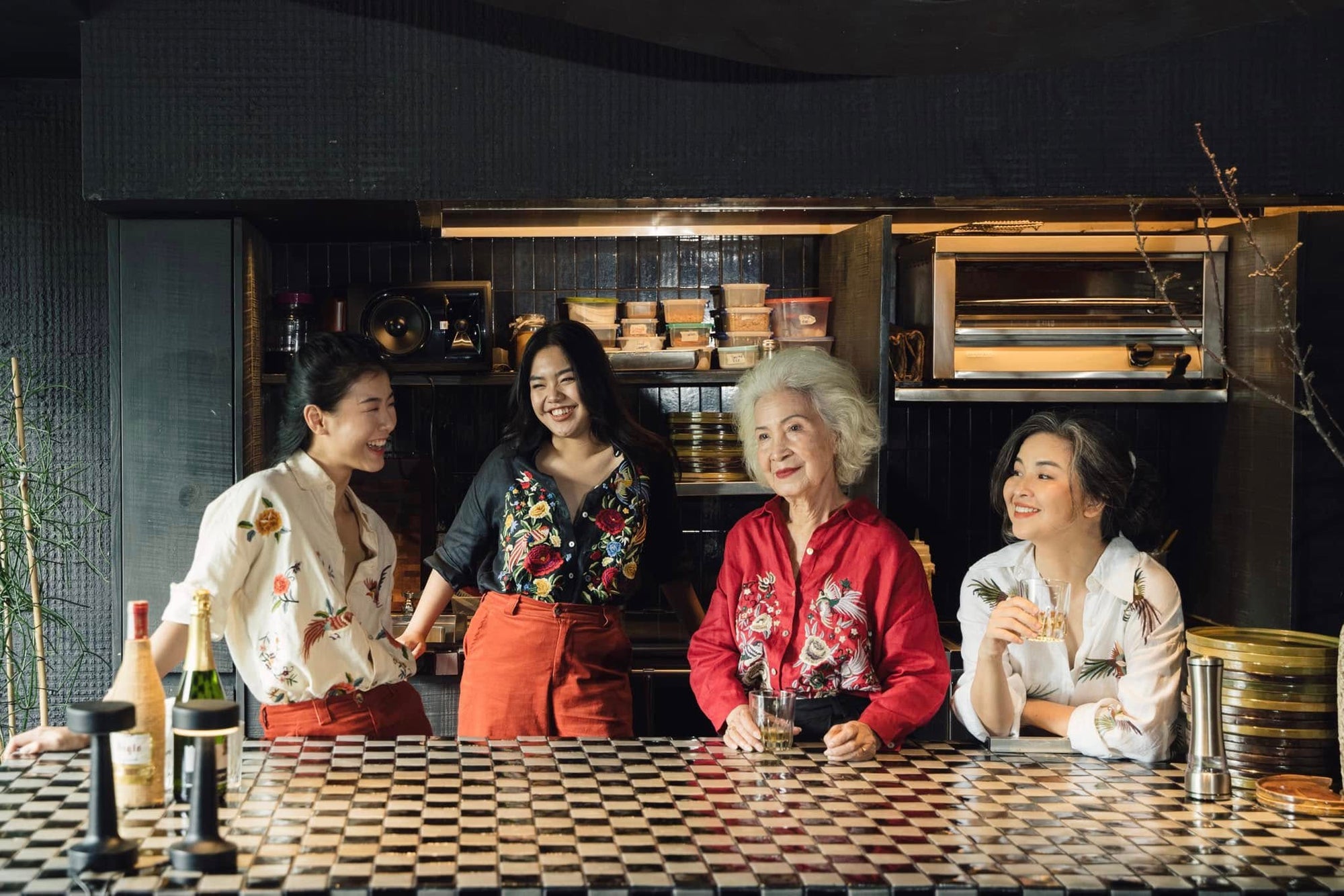 "Fire Phoenix" embroidered red linen shirt by Huulala, featuring Vietnamese floral patterns.