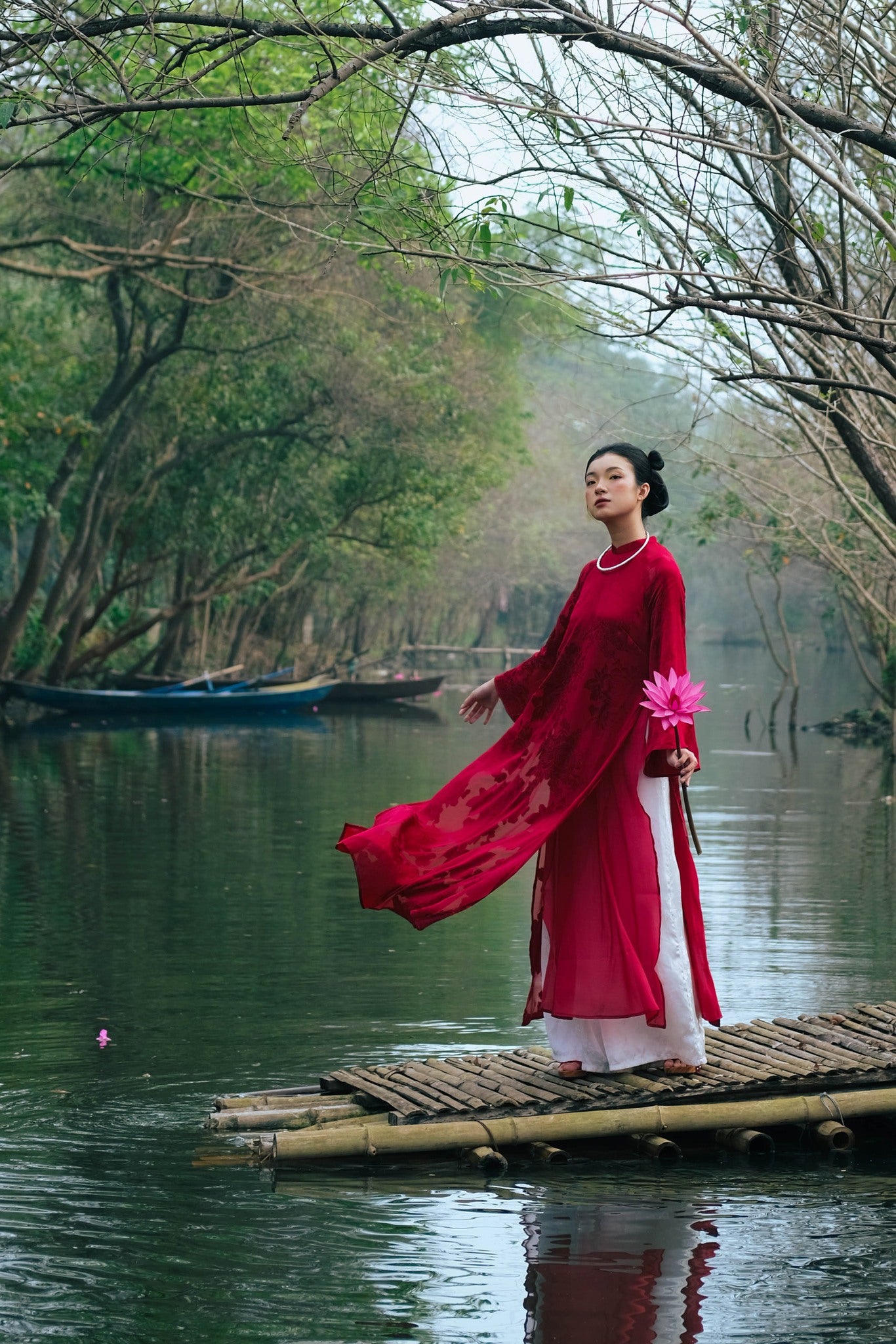 "Traditional Vietnamese Ao Dai in crimson silk, double-layered with flowery patterns, cultural heritage attire."