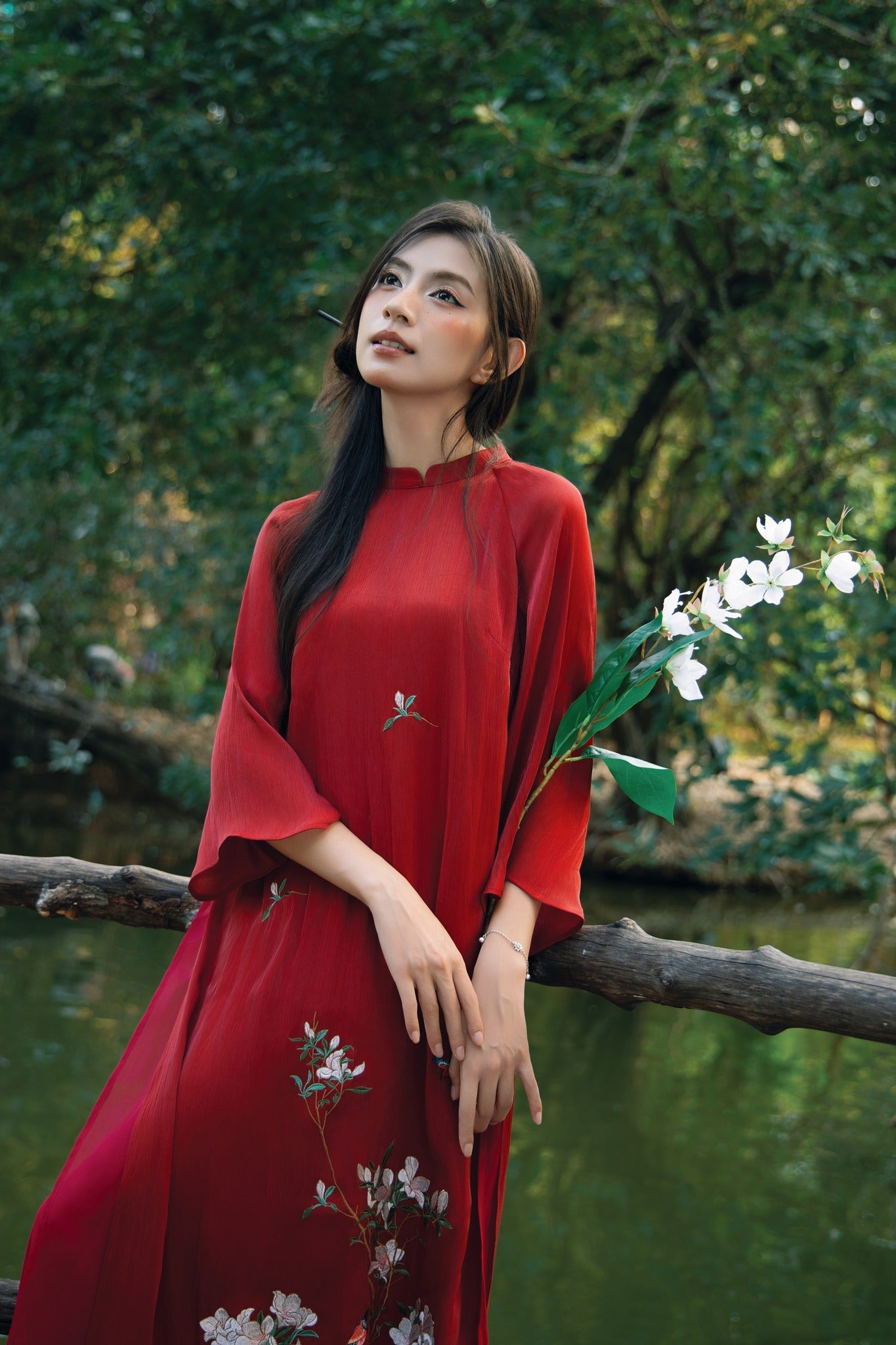 "Red silk 'Giao Mien' Ao Dai with floral embroidery, traditional Vietnamese dress by Moc"