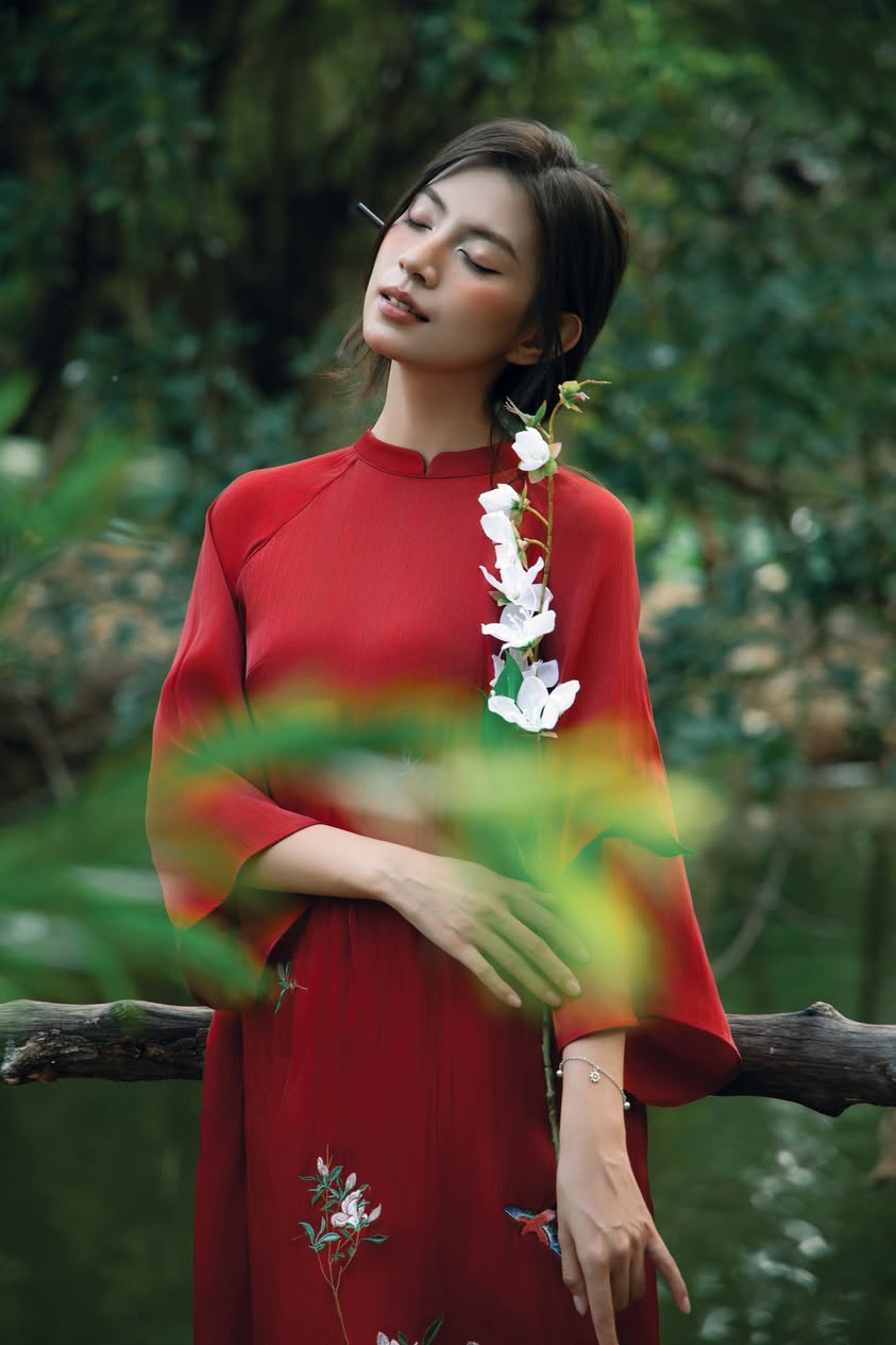 "Red 'Giao Mien' Ao Dai set with silk-embroidered floral design, traditional Vietnamese dress by Moc."