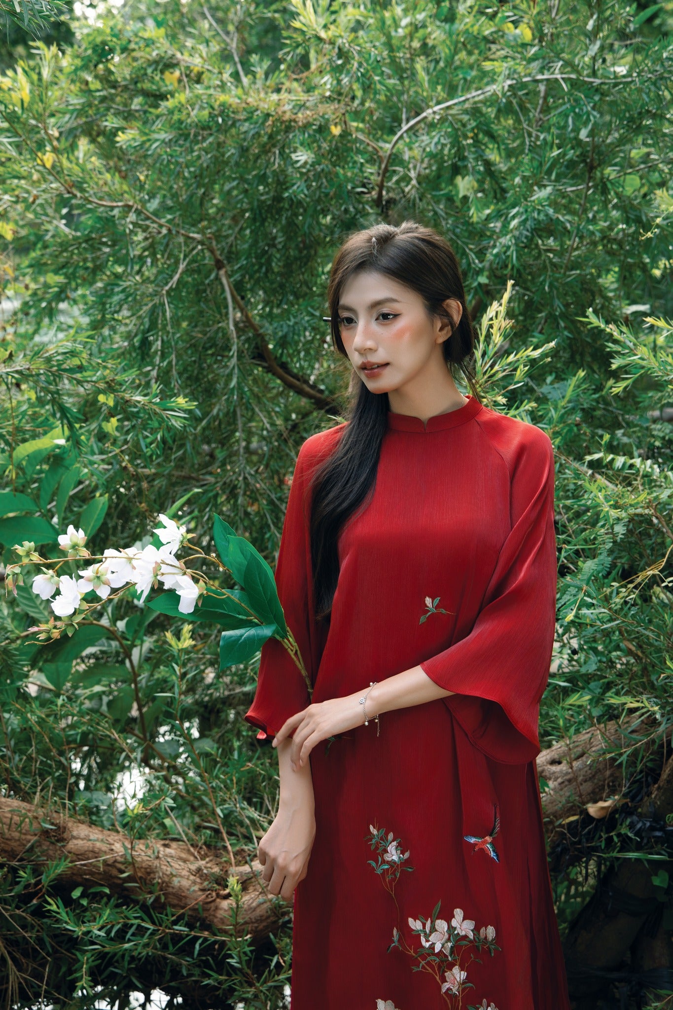 "Red silk 'Giao Mien' Ao Dai set with floral embroidery, traditional Vietnamese dress by Moc."