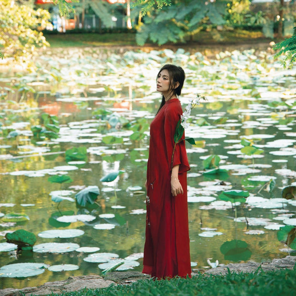 "Red silk 'Giao Mien' Ao Dai with floral embroidery, traditional Vietnamese dress by Moc"