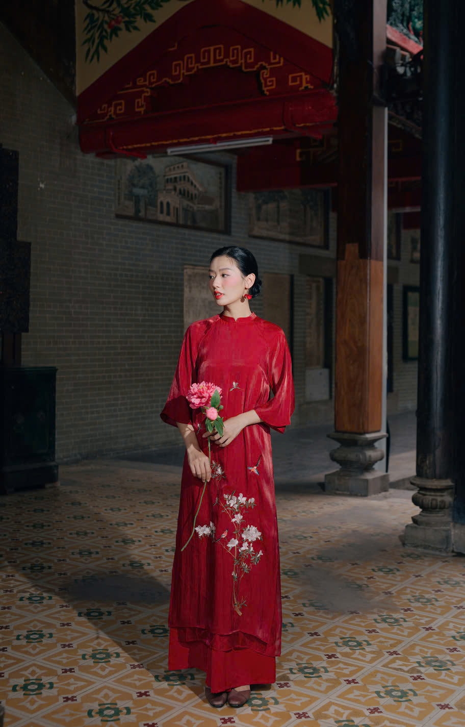 "Red silk 'Giao Mien' Ao Dai with floral embroidery, traditional Vietnamese dress by Moc"
