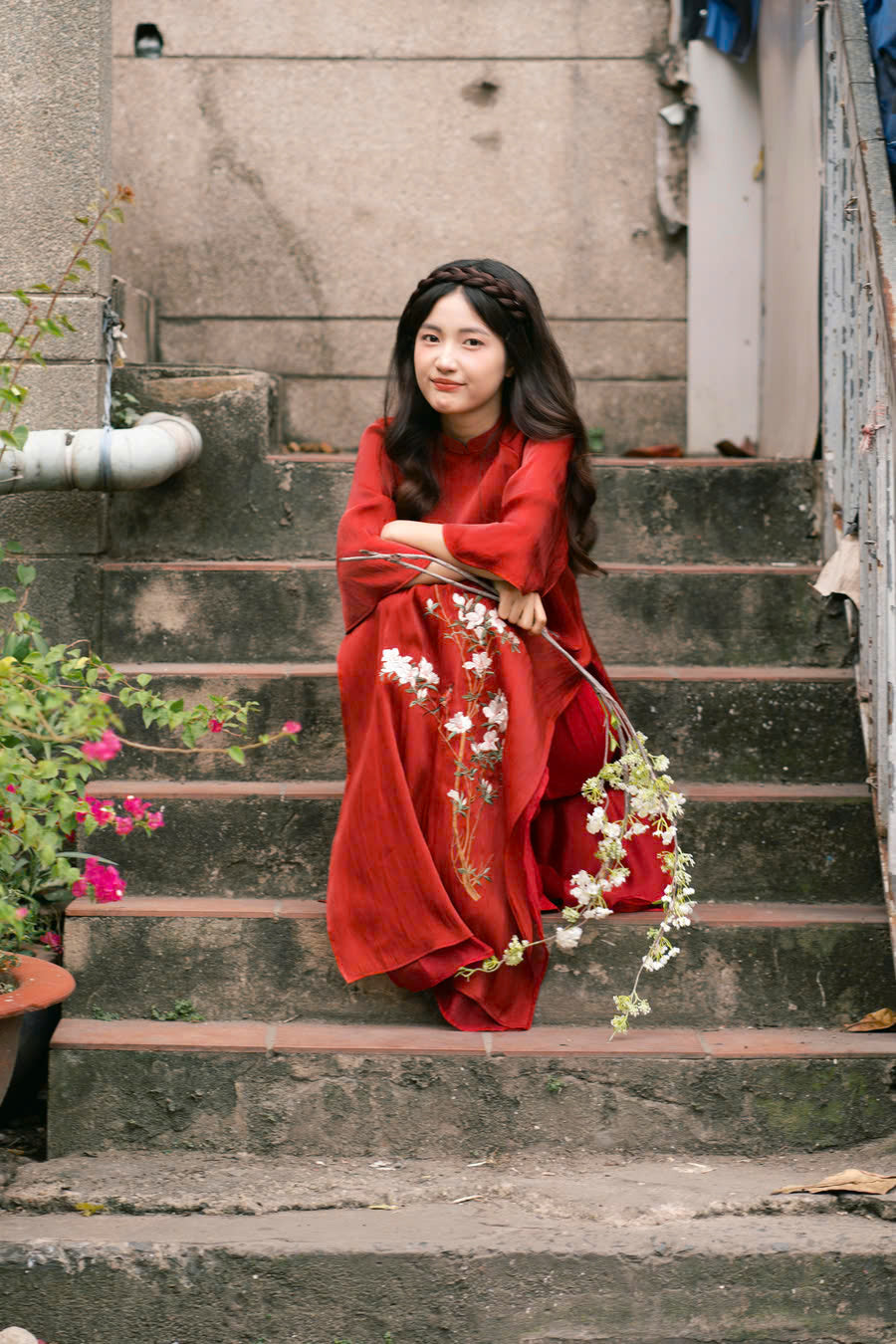 "Red silk 'Giao Mien' Ao Dai with floral embroidery, traditional Vietnamese dress by Moc."