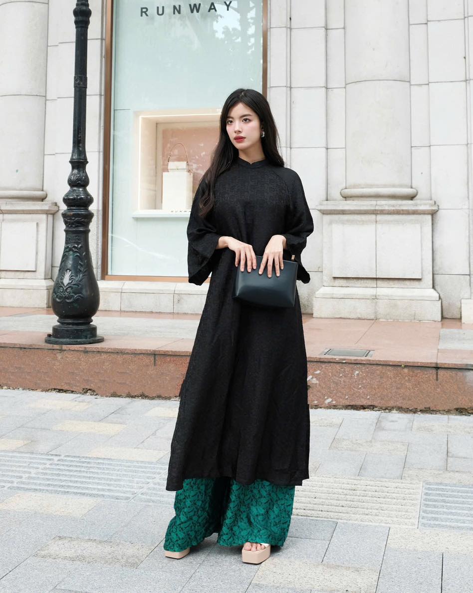 "Traditional Vietnamese Ao dai set in black silkworm silk with modern artisan design by Moc"