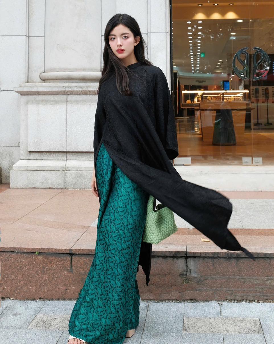 "Huyen Hoa Ao dai set in black silkworm silk, traditional Vietnamese dress by Moc."