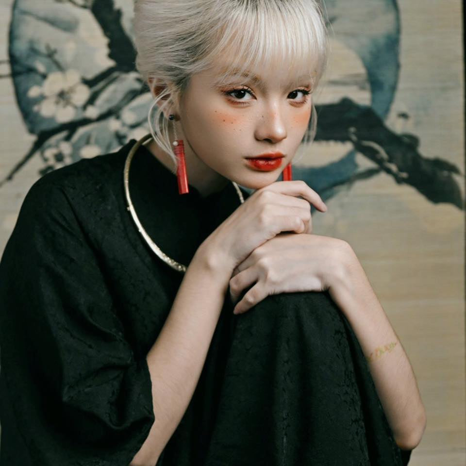 "Elegant Huyen Hoa Ao dai set in black silkworm silk, traditional Vietnamese dress by Moc."