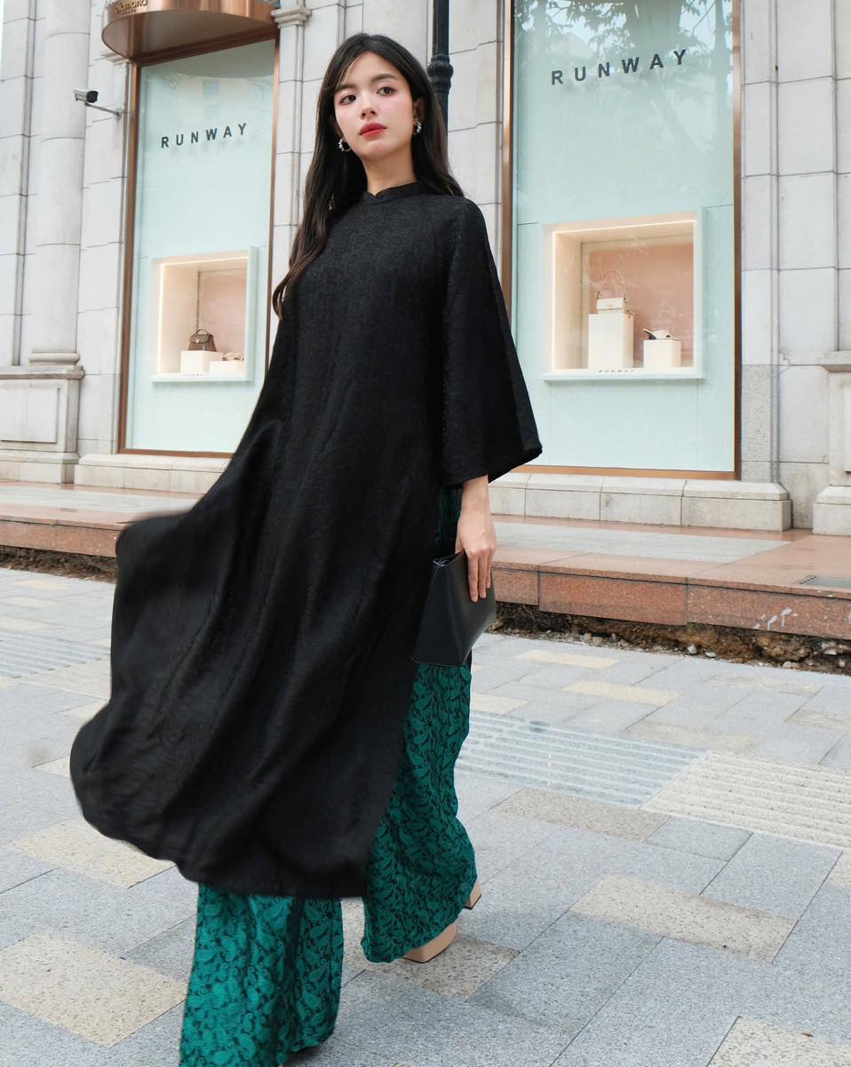 "Traditional Vietnamese Ao dai set in black silkworm silk with modern design by Moc"