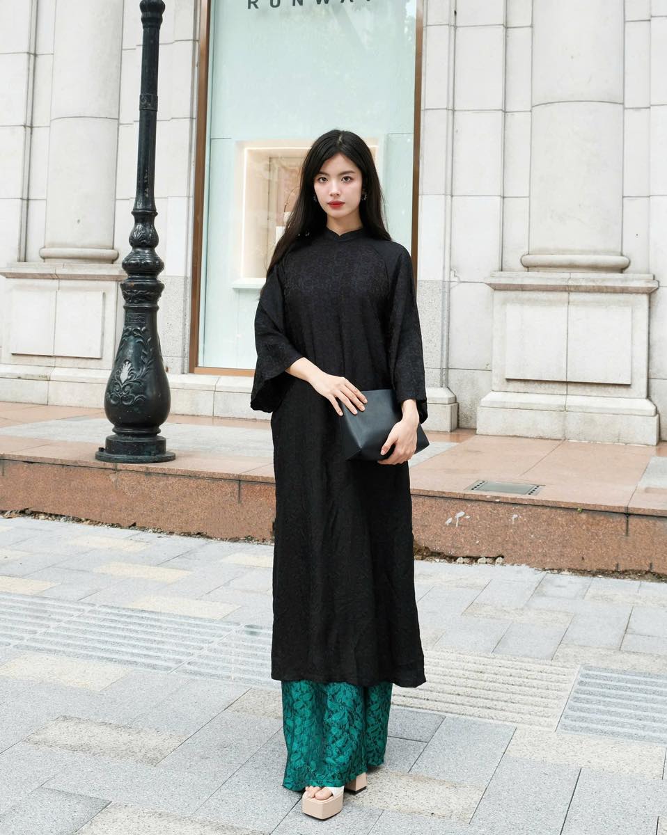 "Elegant 'Huyen Hoa' Ao dai set in black silkworm silk, traditional Vietnamese dress by Moc."