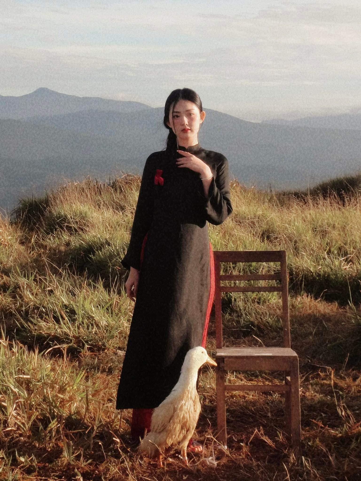 "Traditional Vietnamese Ao dai in black artisan silk with modern design, cultural authenticity."