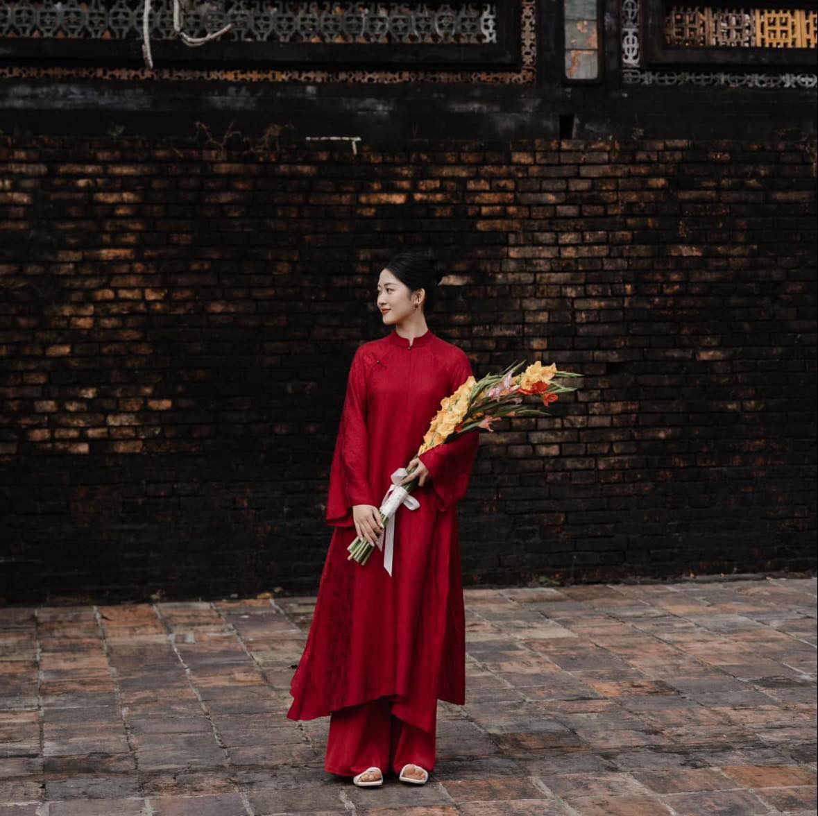 "Hy Loan Ao Dai set in crimson silk by Lalin, traditional Vietnamese dress"